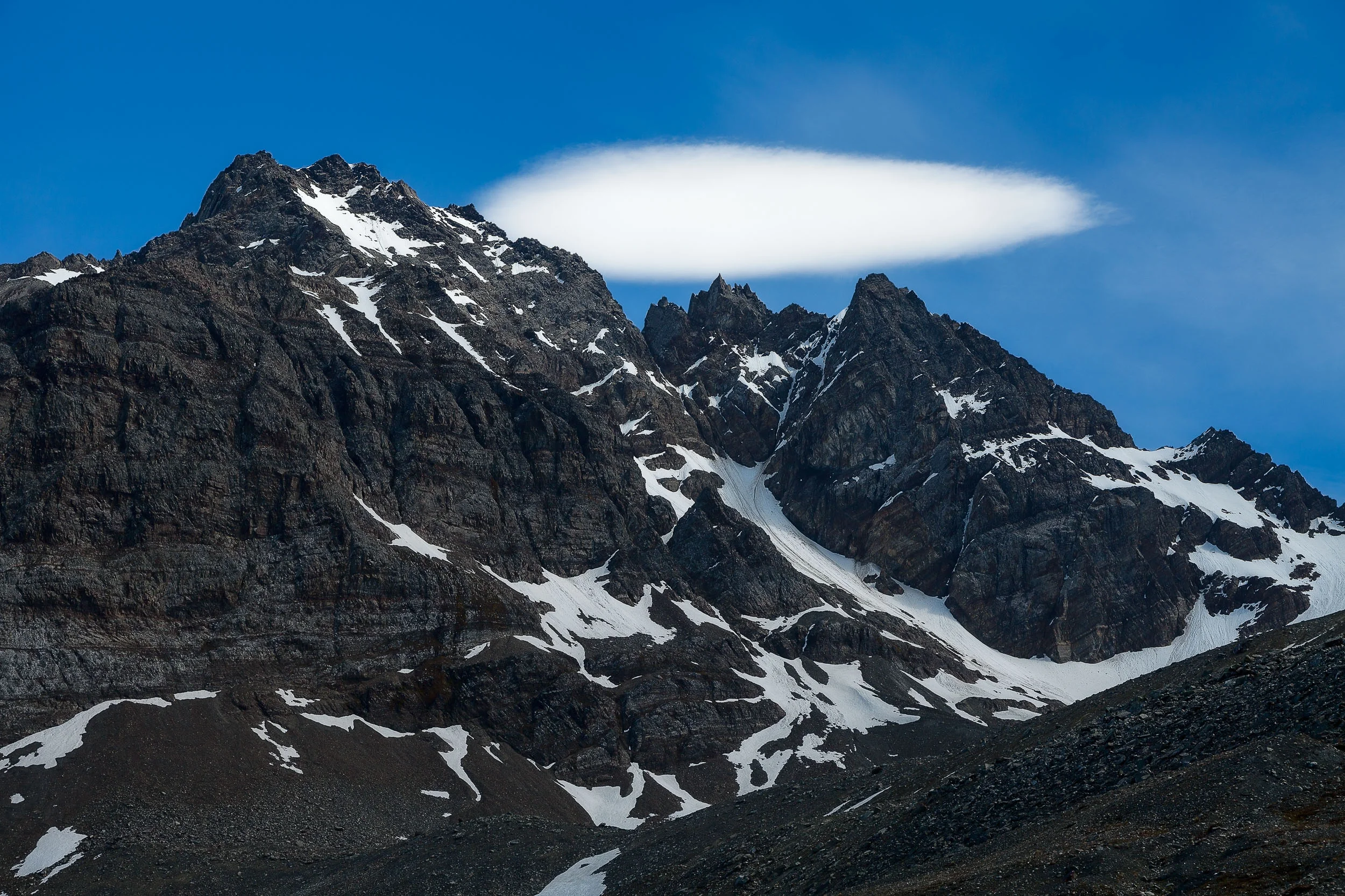 Spectacular view of low lying cloud over mountain peaks, South Georgia Island.