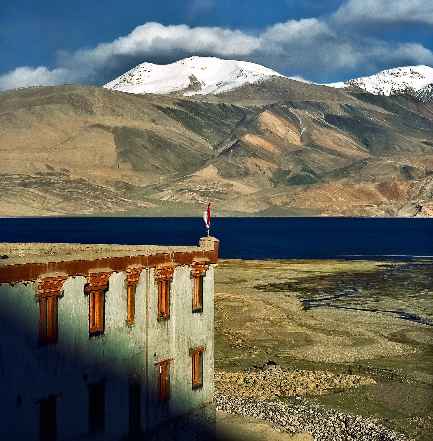 A beautiful Buddhist monastary in a spectacular landscape on the shores of Pangong Tso in Ladakh, India