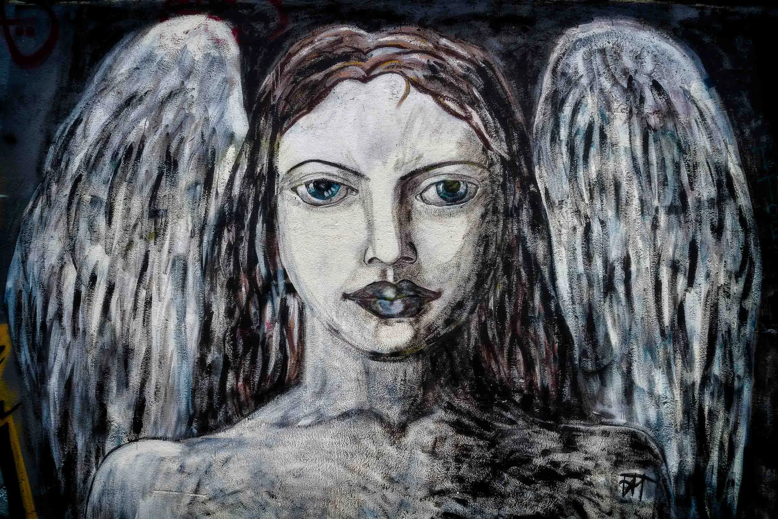 A beautiful example of street art , this female angel in suburban Melbourne .