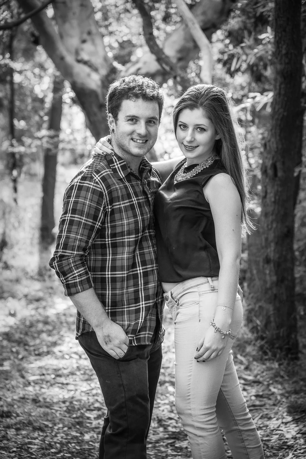Loving couple on a sunny bush trail in Hamilton, Australia.