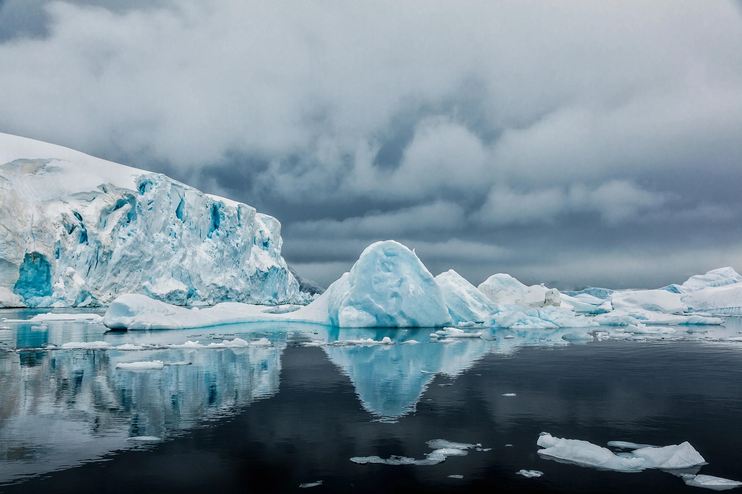 A spectacular zodiac cruise on tranquil waters around Cuverville Island, Antarctica.