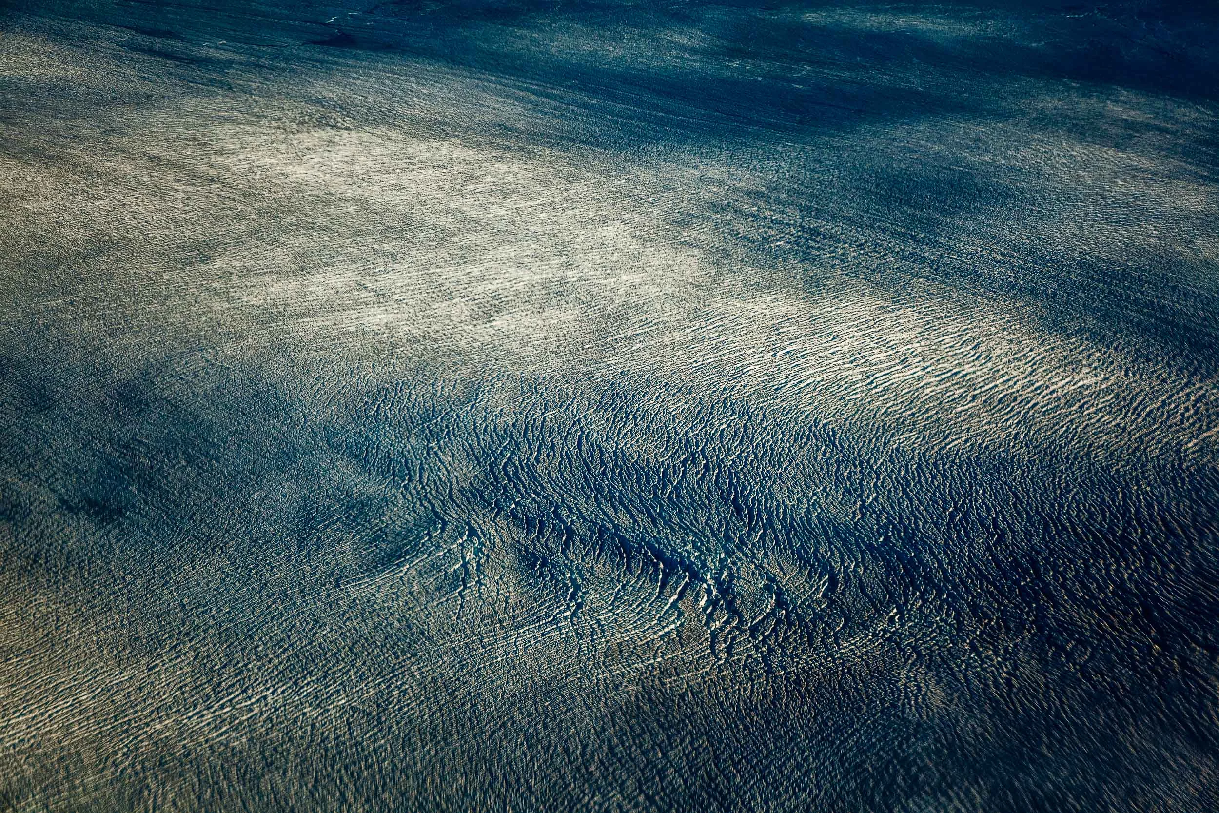 This photo was made, from above, while flying over the ice near the town of Ilulissat on the west coast of Greenland .