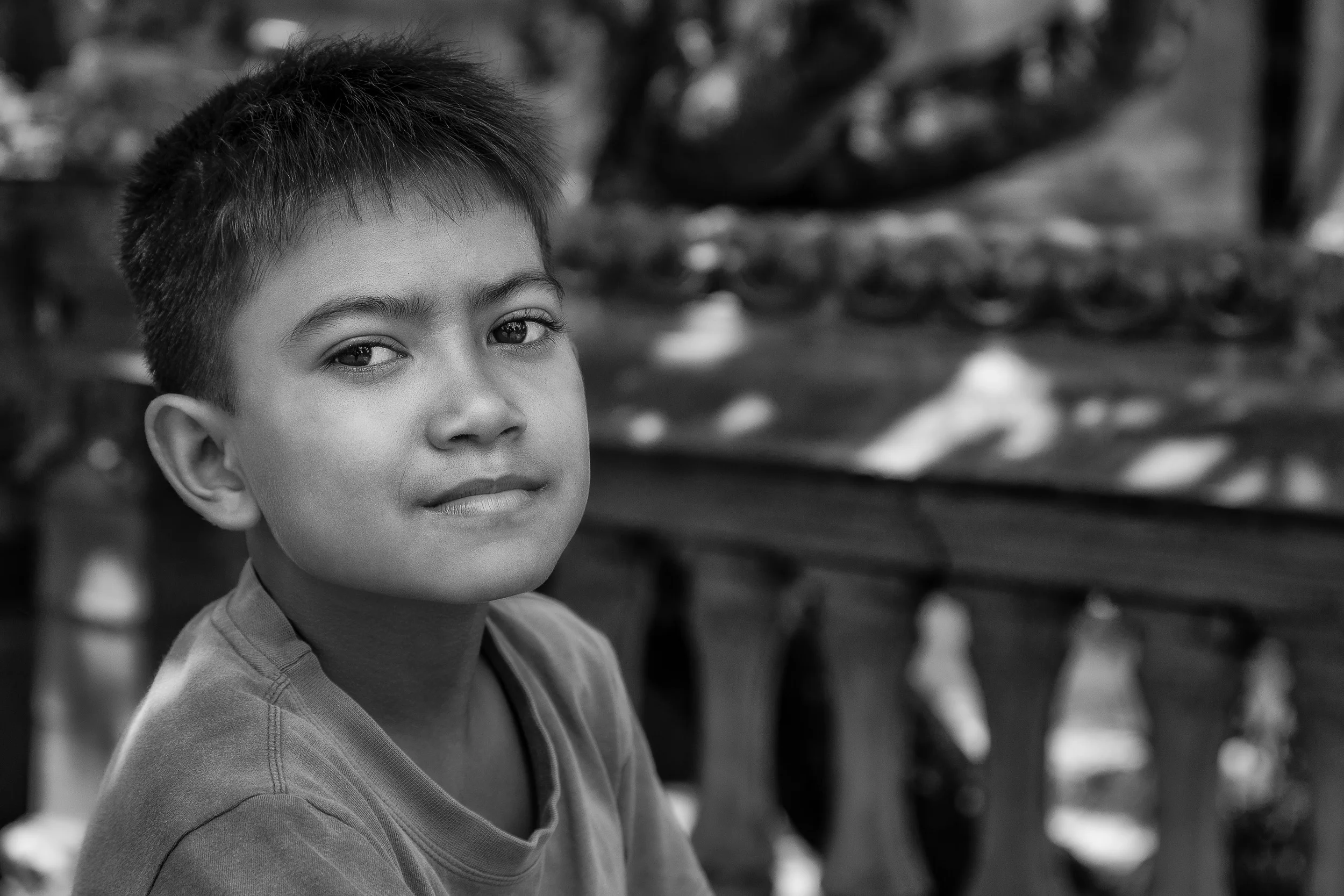 Beautiful photo of a young boy, at a temple, in Bali, Indonesia.