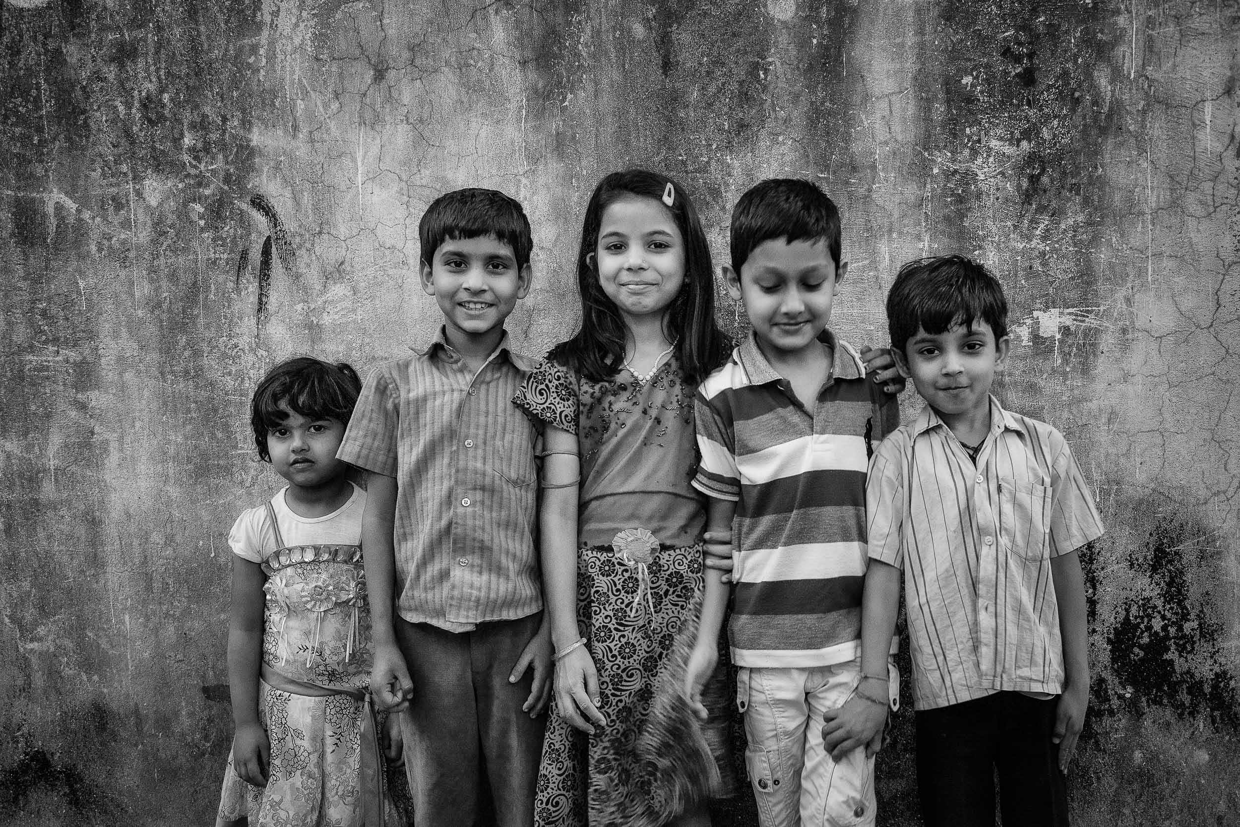 Group photo of kids in an alleyway in Kolkata, India.