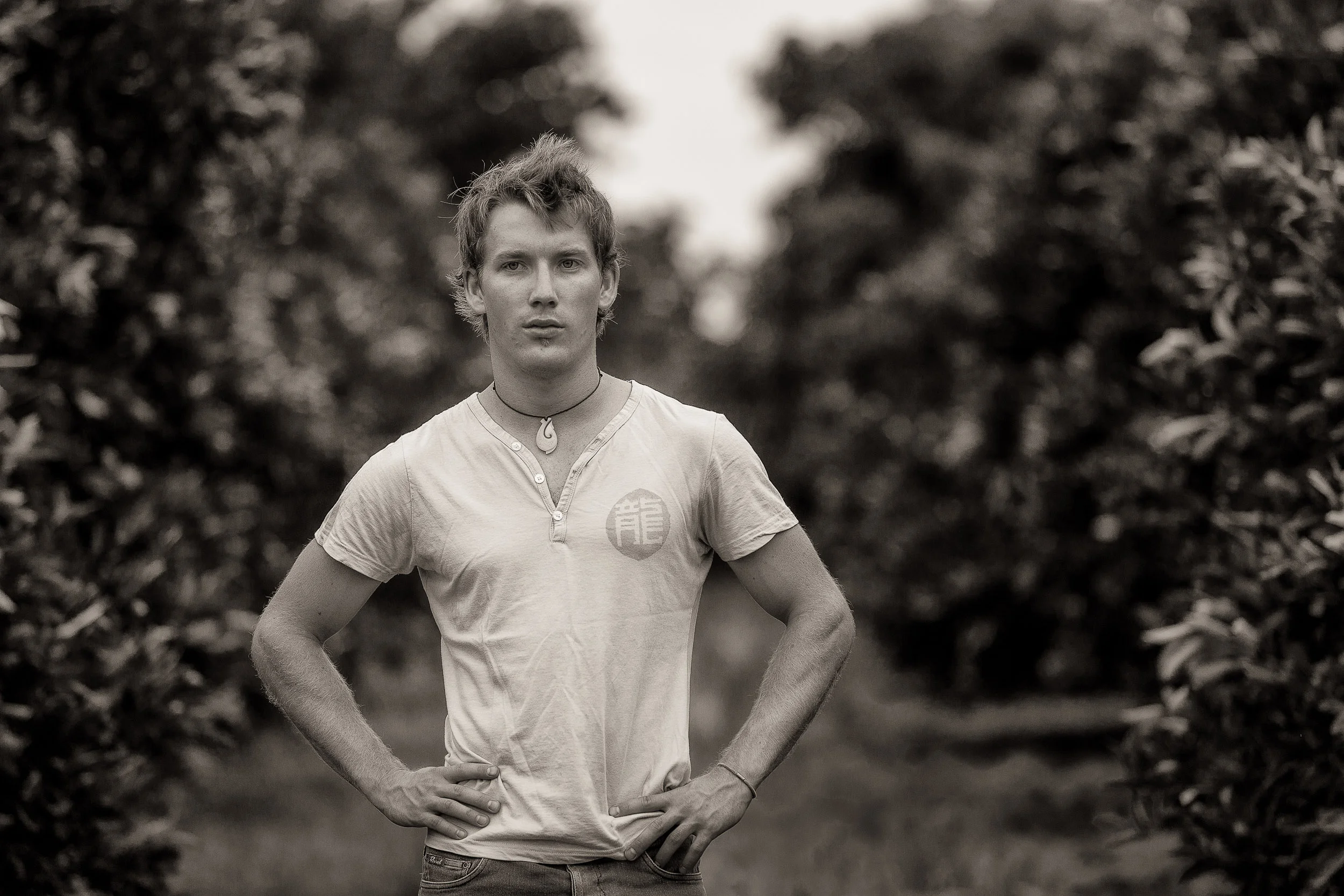 A portrait of local, Jake , in an orange grove in Mildura, Australia .