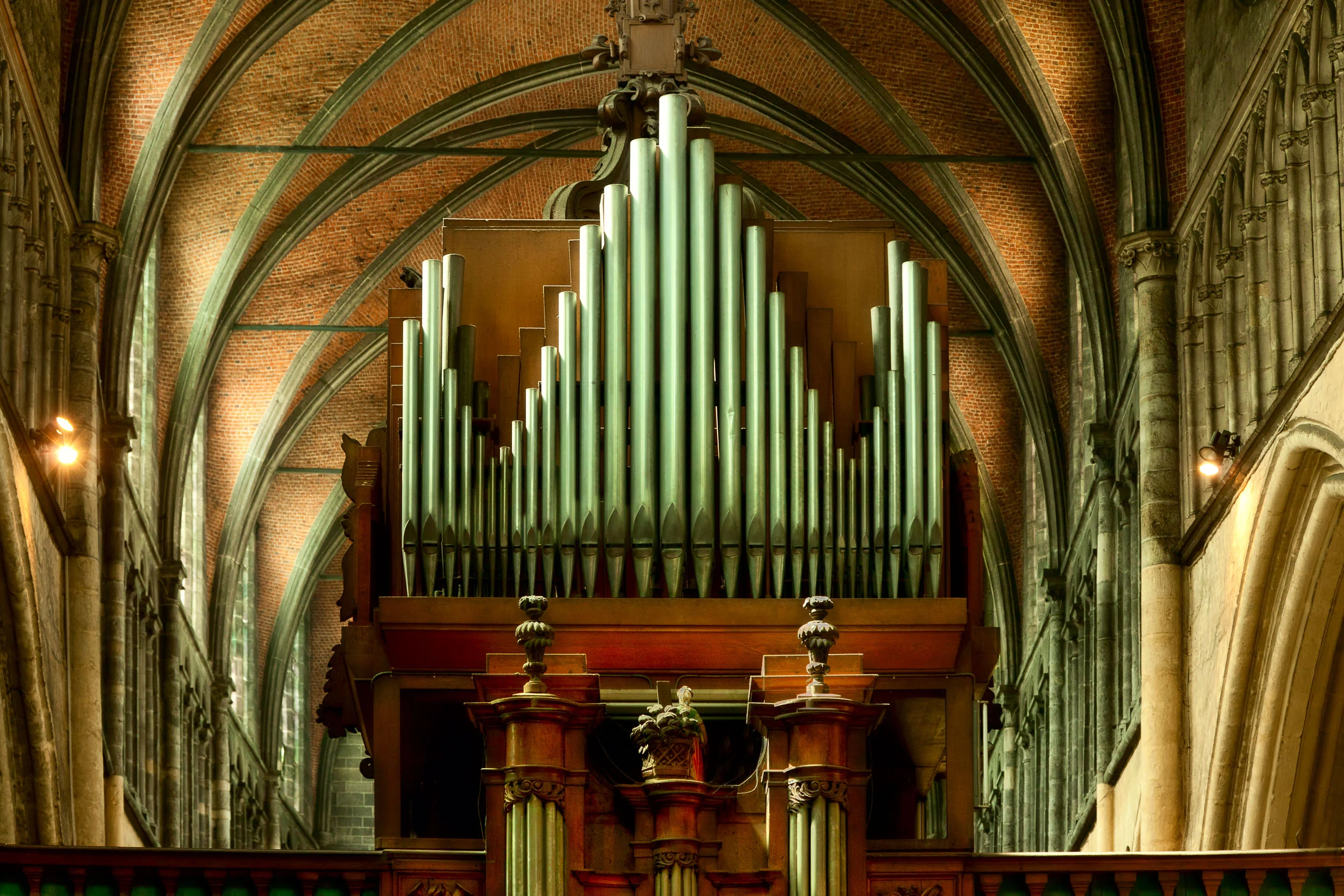 A spectacularly beautiful church organ in the Church Of Our Lady in Bruges, Belgium .