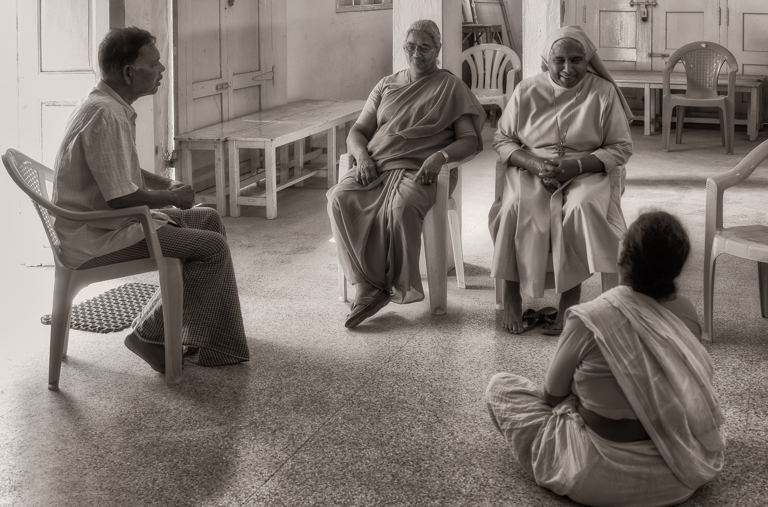 A casual conversation in the multi-purpose hall in the village of Maria Purem (a village named after by mother ) near Chennai, India