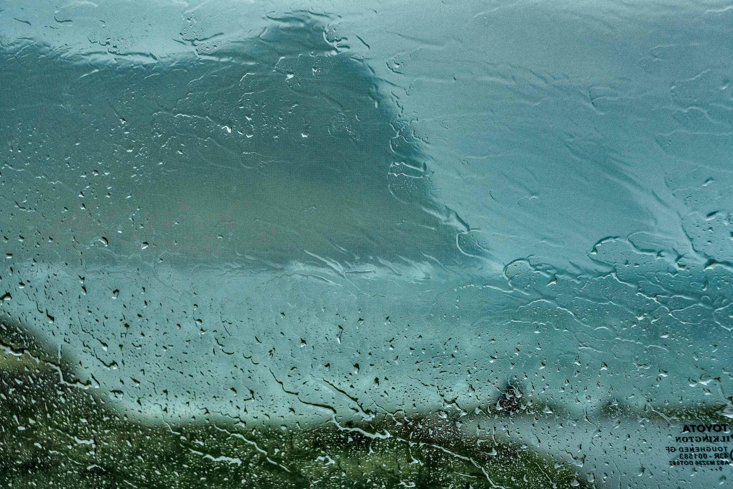 This photo was made, while sheltering in my car from heavy rain and gale force winds , in the town of Vidareidi , the northernmost settlement in the Faroe Islands .
