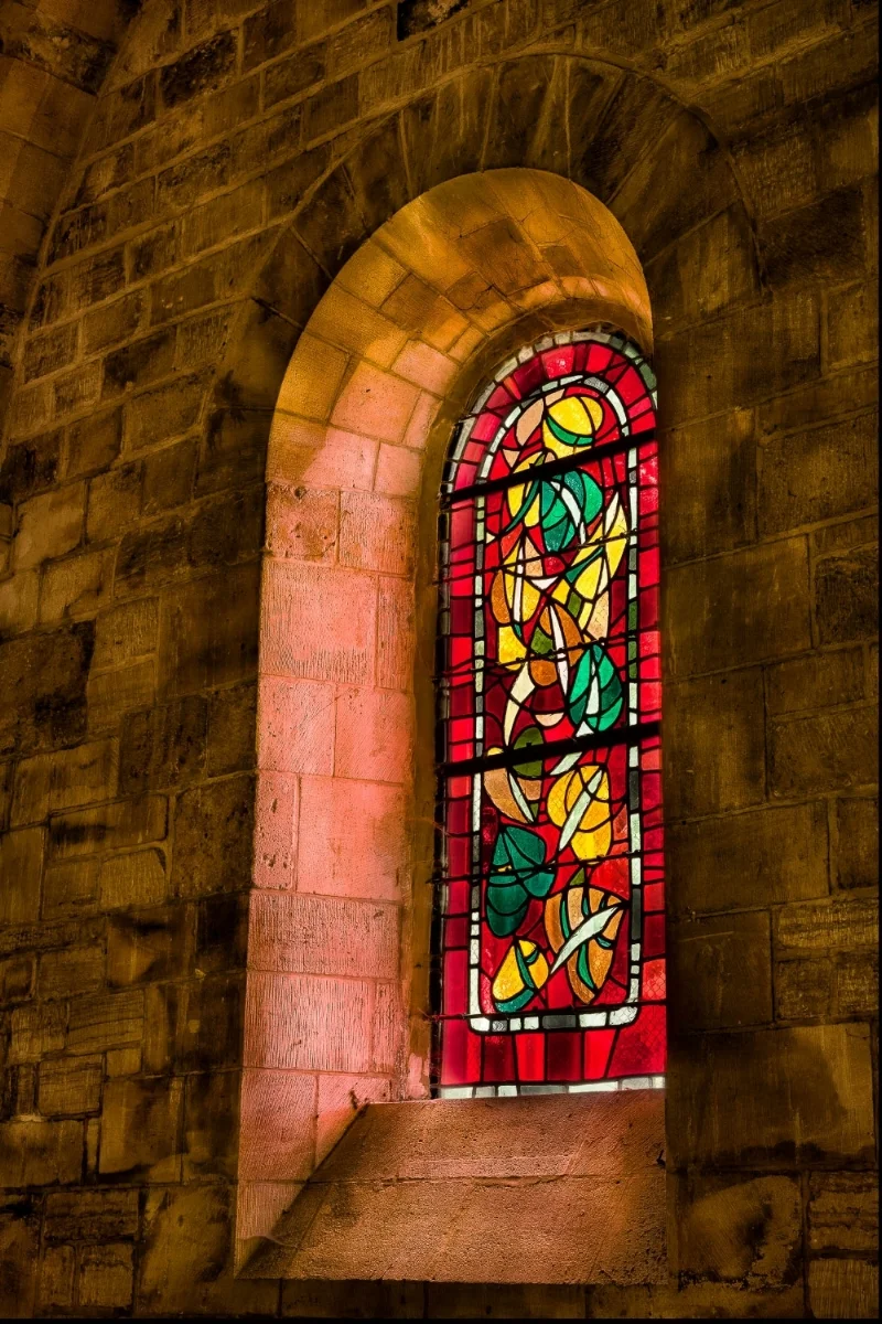 Stained glass window in a small chapel next to the Sacre Coeur Basilica in Paris, France .