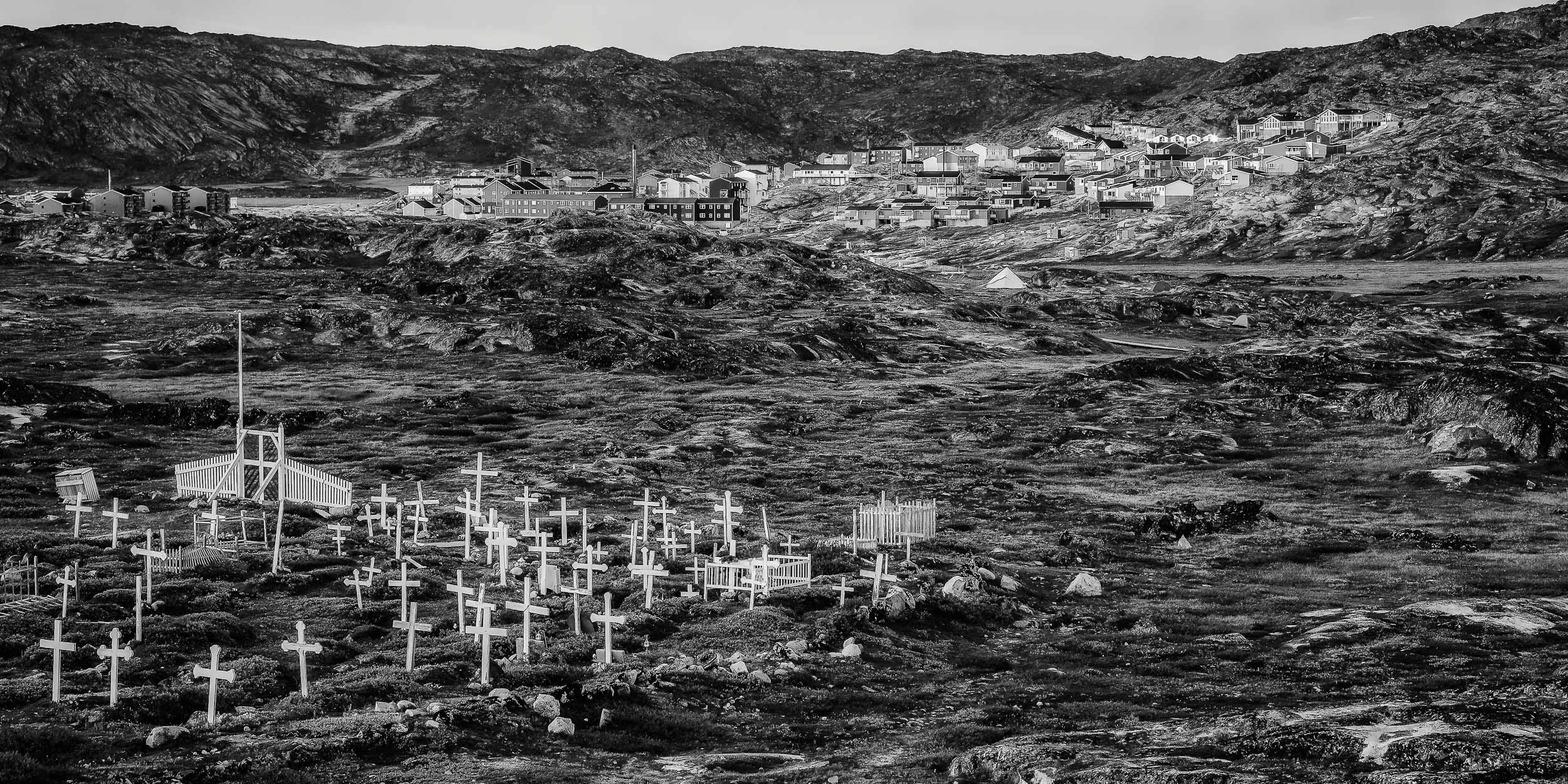 A late evening view of the cemetery and town outskirts at Ilulissat, Greenland