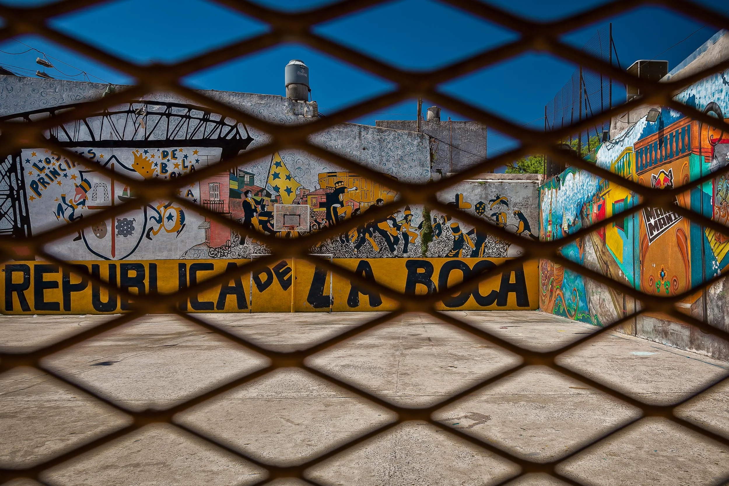 Looking through the wire at colorful walls in La Boca, Buenos Aires, Argentina .
