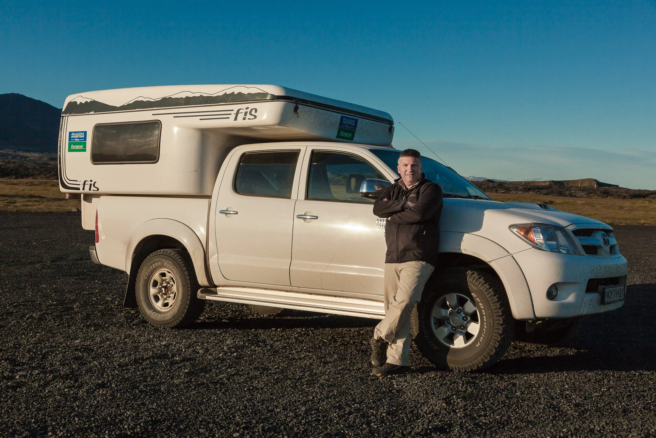 That's me, Glenn Guy , the Travel Photography Guru , pictured with camper van while on tour in Iceland .