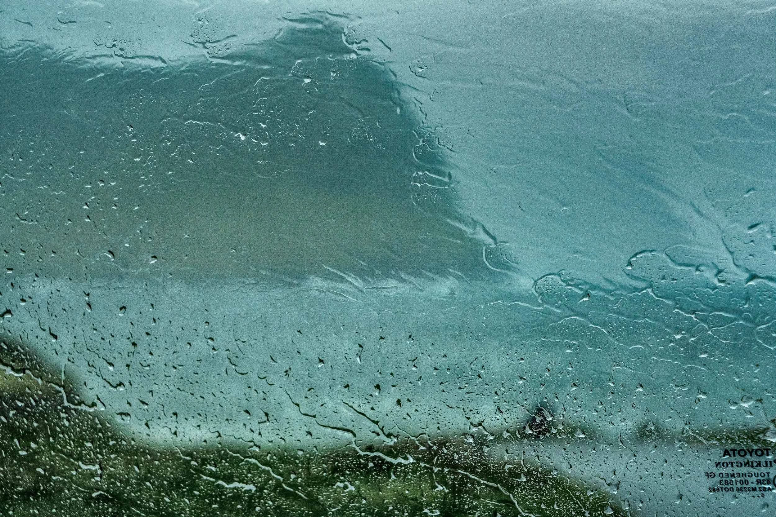 This photo was made, while sheltering in my car from heavy rain and gale force winds , in the town of Vidareidi , the northernmost settlement in the Faroe Islands .