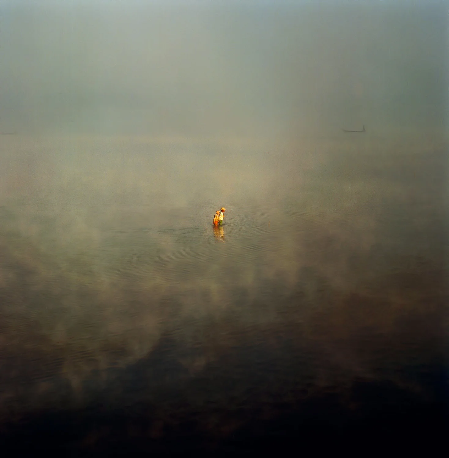 A medium format image made with a Hasselblad 500CW camera and a Hasselblad 150 mm Sonnar f4 lens . Fisherman on Taungthaman Lake near the town of Amarapura in Myanmar (i.e., Burma).