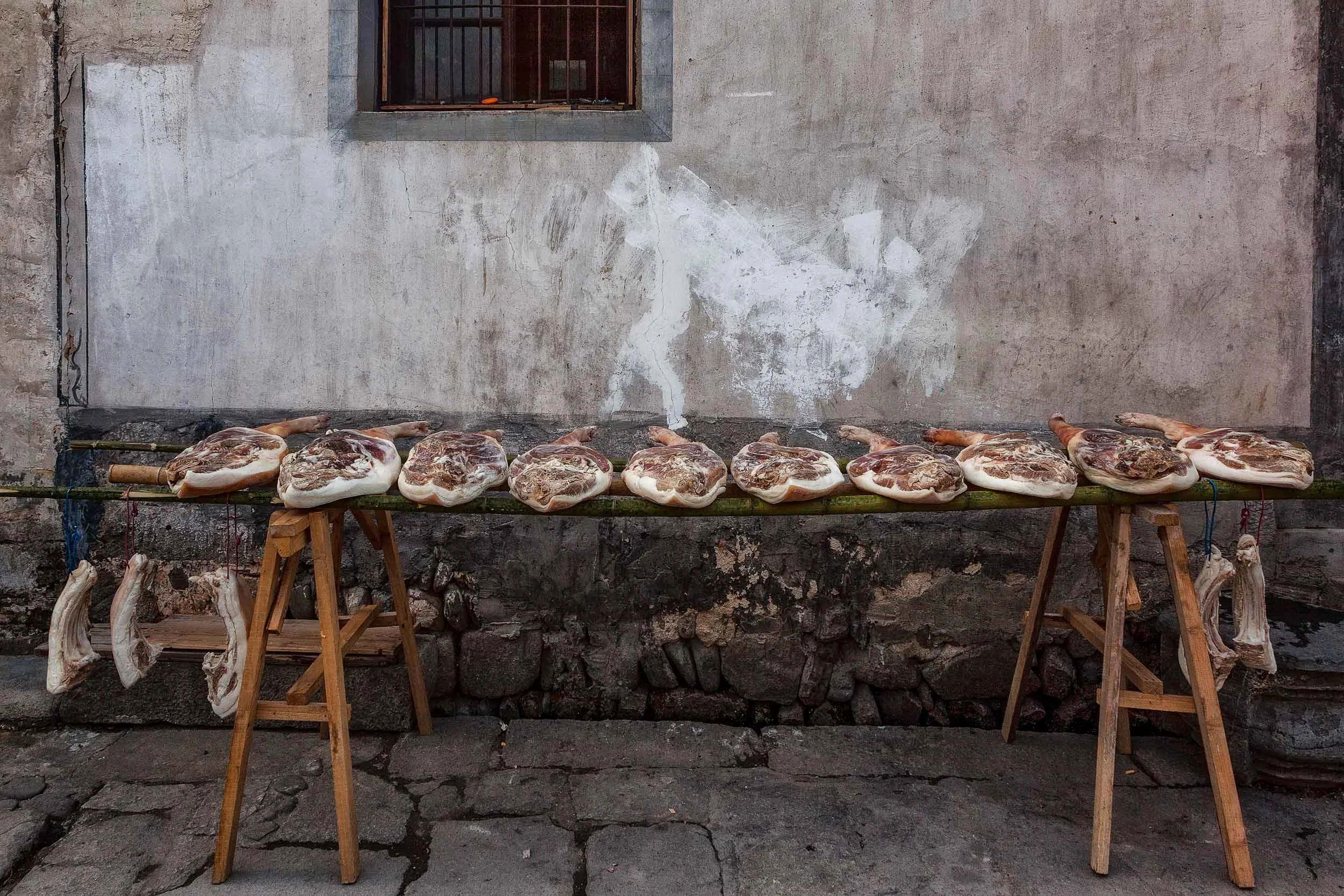 A detailed image of goods for sale in a local butcher shop in the traditional village of Hongcun, China . One of many curious sights you can find photographing China.