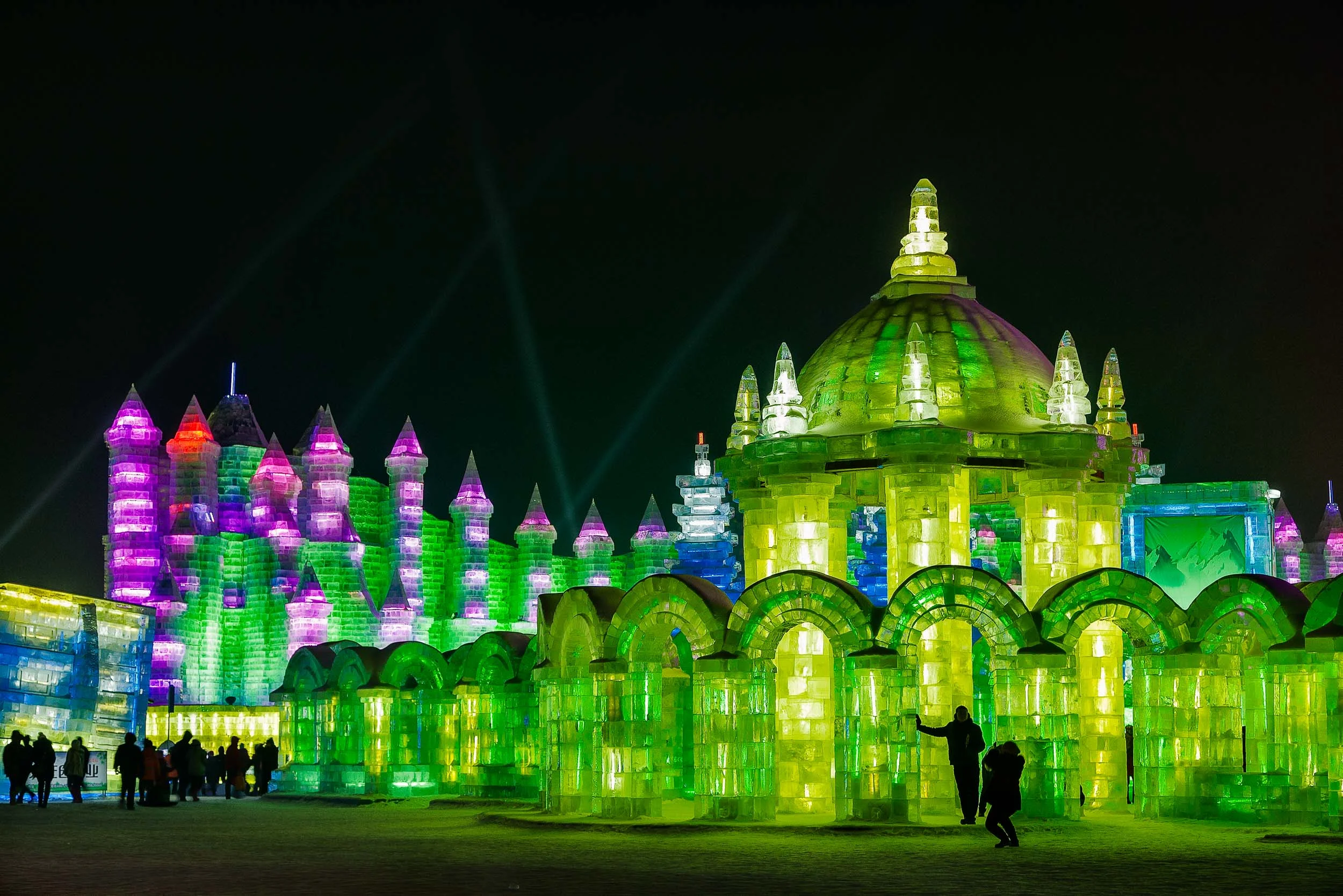 Surreal ice sculptures at night at Ice World in Harbin, China.