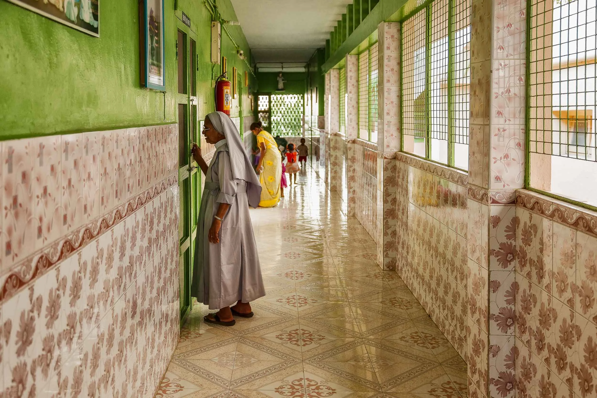 Catholic nun, caring for children, on St Thomas Mount in Chennai, India.