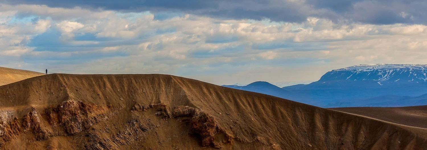 Tourist Walking Along Volcano Rim, Iceland