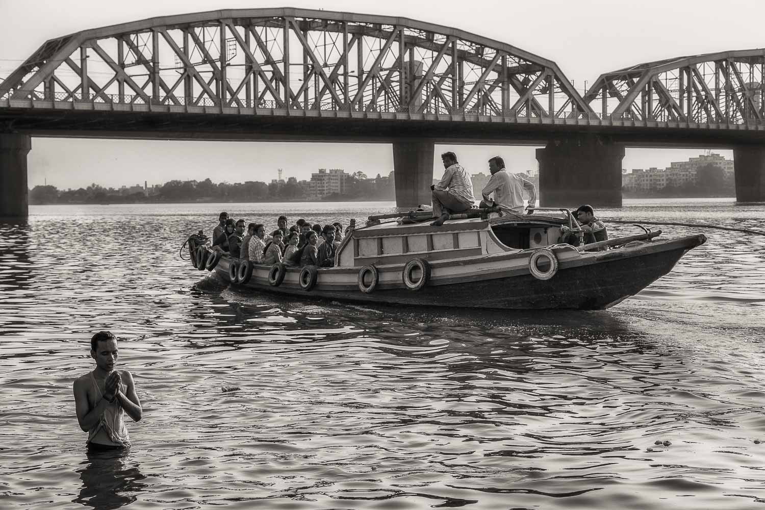 Devotee Praying in the Hooghly River, Kolkata, India