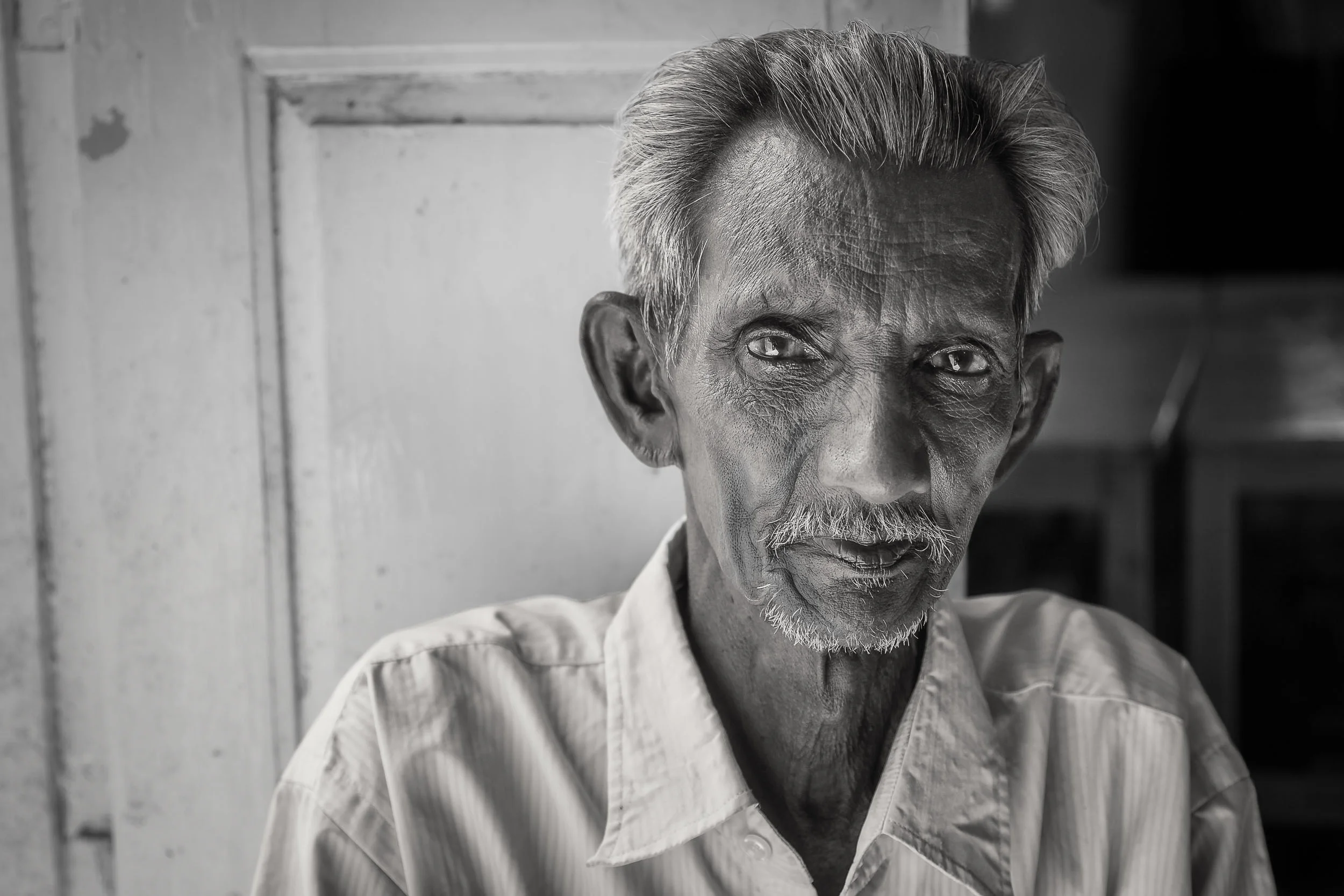 Street photos, like this elderly man portrait, are everywhere in Chennai, India.