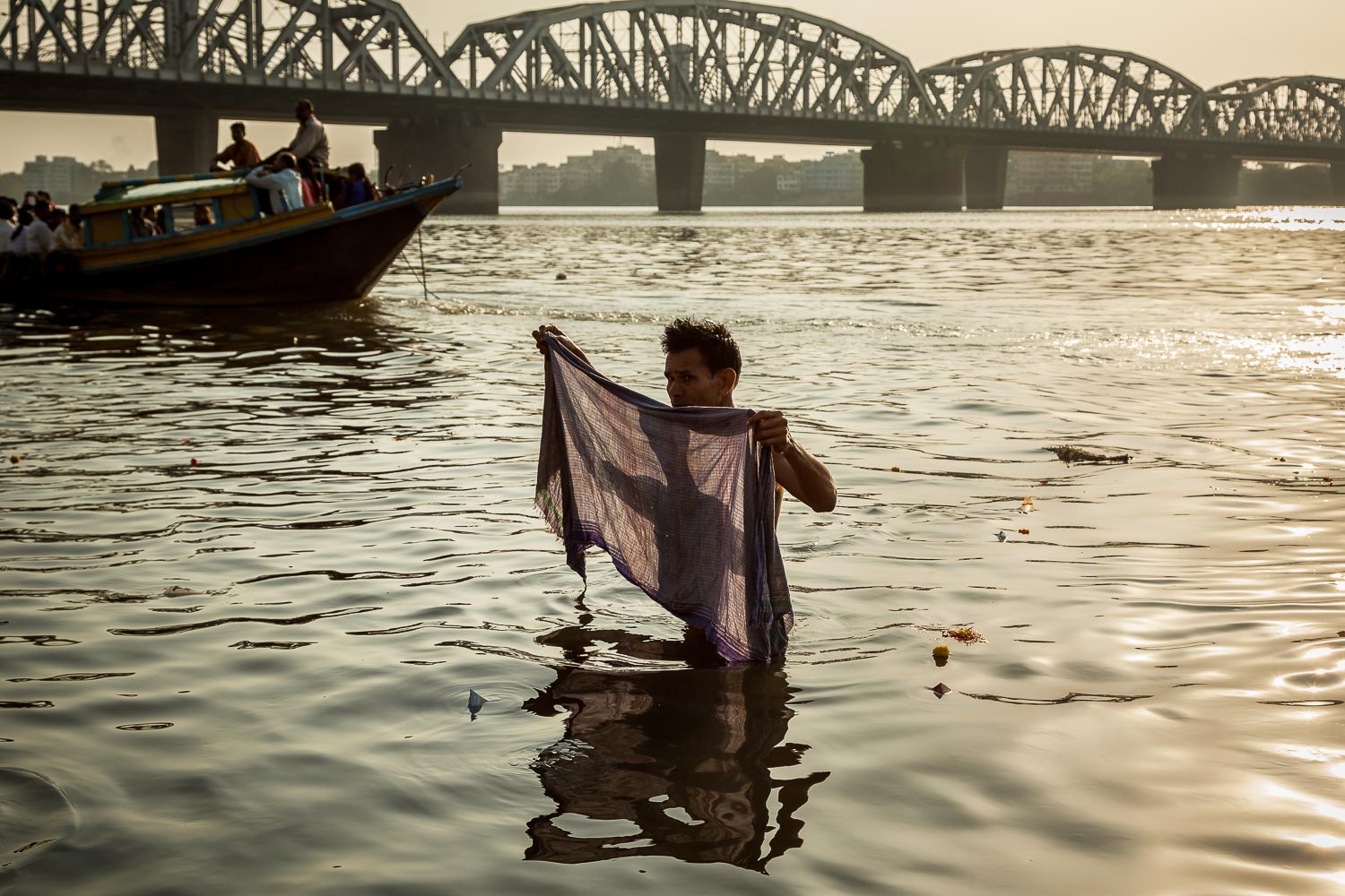 Pilgrim in the Hooghly River at Sunset, Kolkata, India