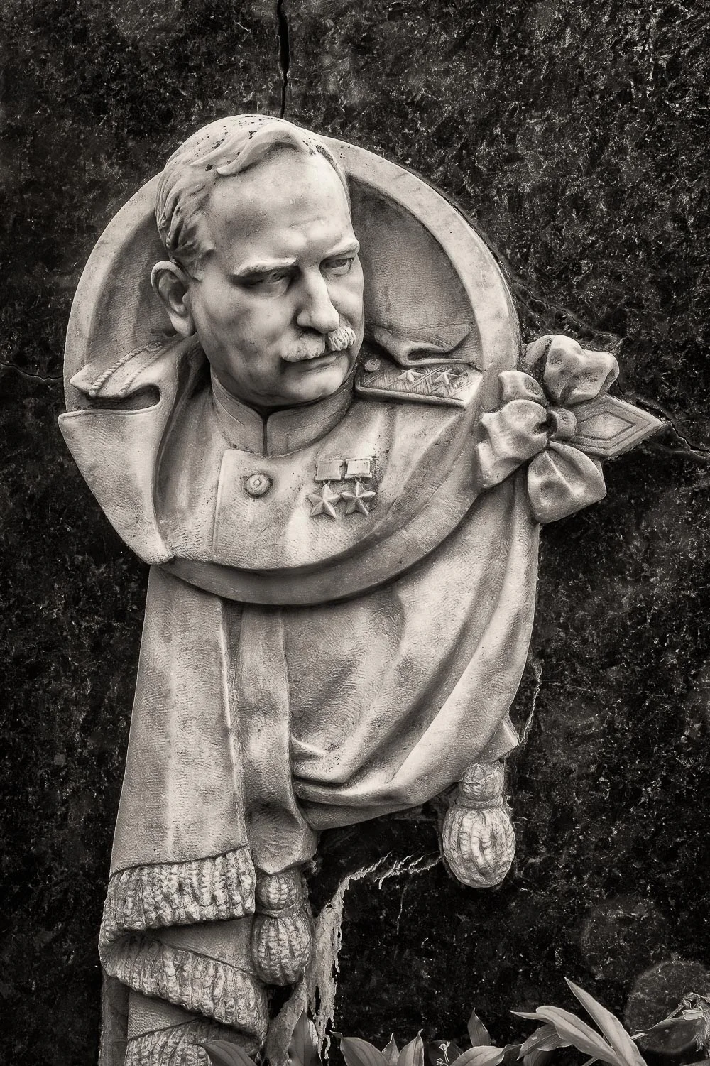 A beautifully carved bust of an important military figure on his grave at Novodevichy Cemetery in Moscow, Russia .
