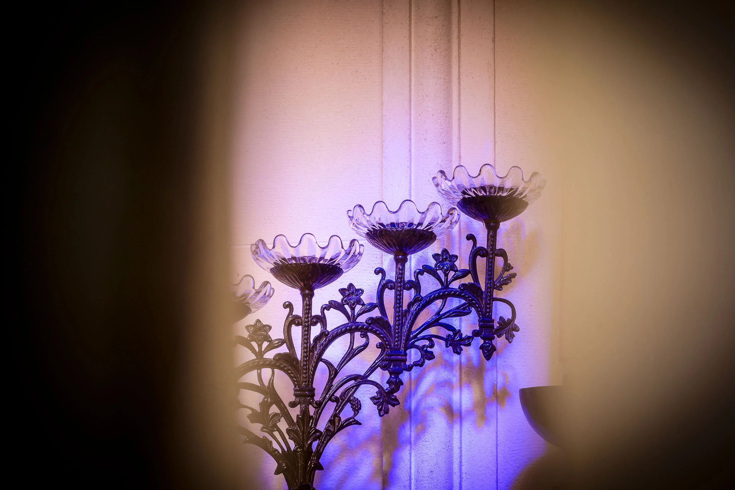 A colorful detail of a candelabra inside a crypt at La Recoleta Cemetery in Buenos Aires, Argentina .