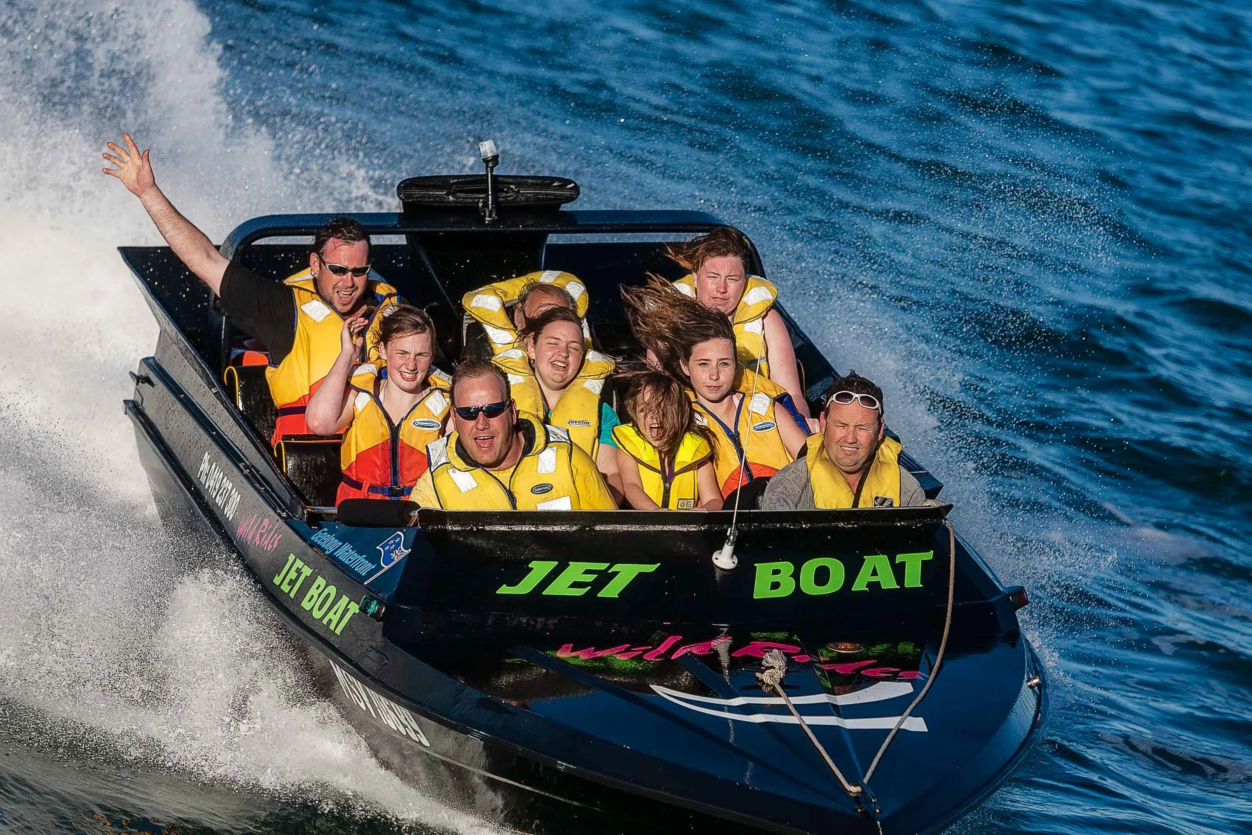 Excitement is evident on the faces of passengers as they jet boat around the harbour in Geelong, Australia .
