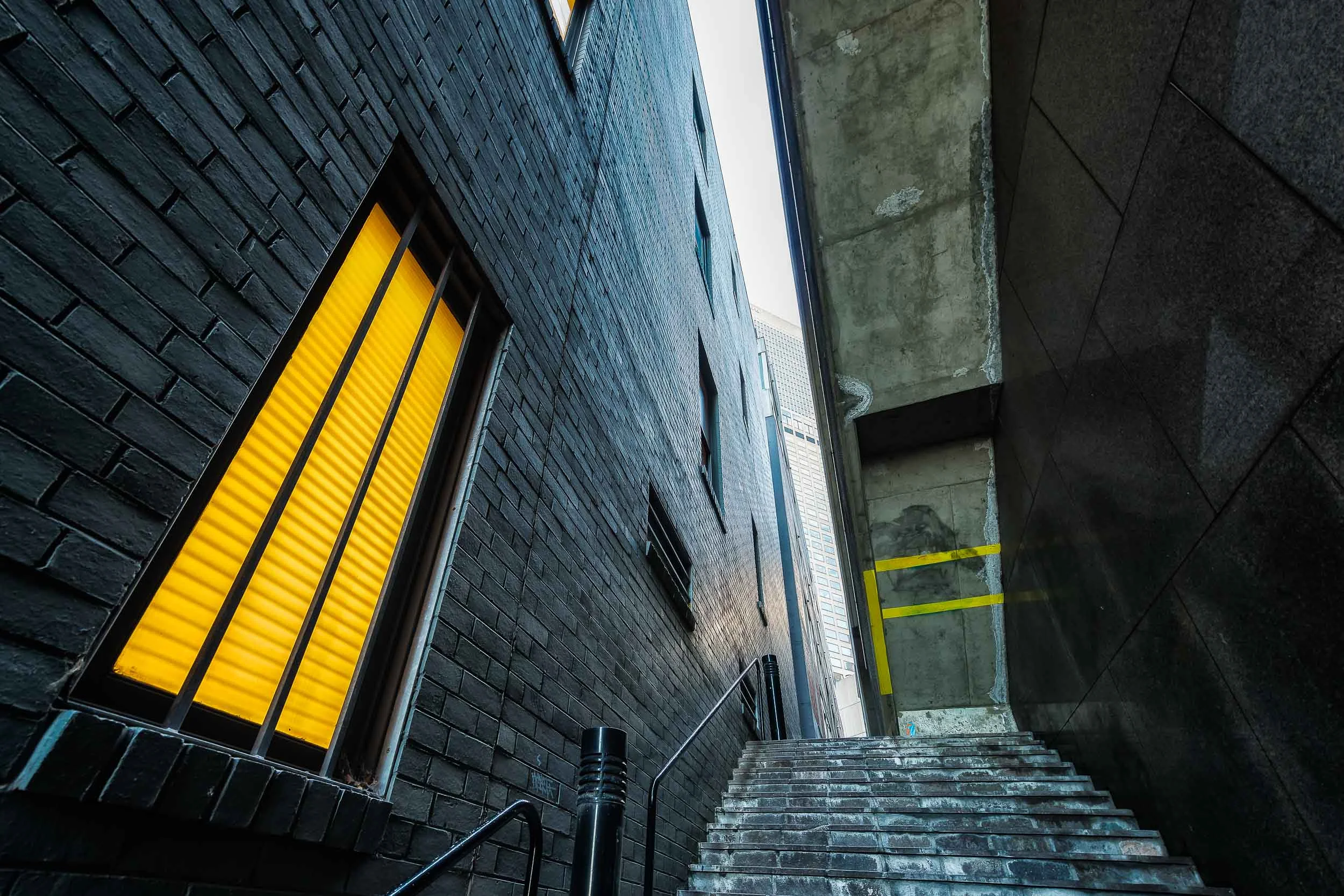 A steep staircase leads the visitor through a narrow alleyway in the City of Melbourne, Australia .