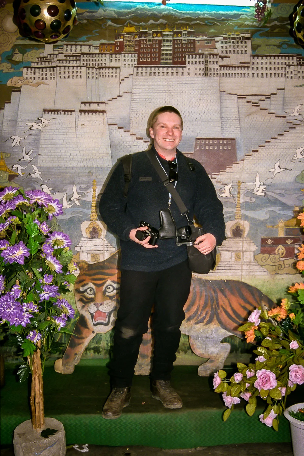 Glenn Guy , owner and primary content producer at the Travel Photography Guru website and blog, photographed in 2000 at a portrait photography studio in Lhasa, Tibet .
