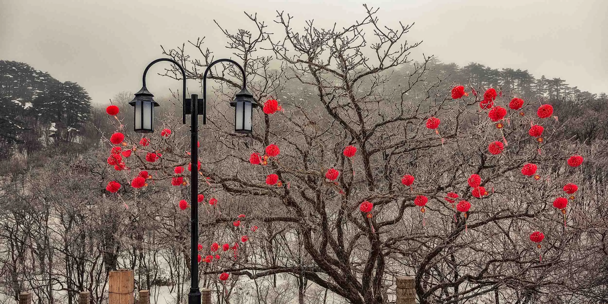 Red decorations welcome the visitor outside a hotel on Huangshan (i.e., Yellow Mountain) in China .