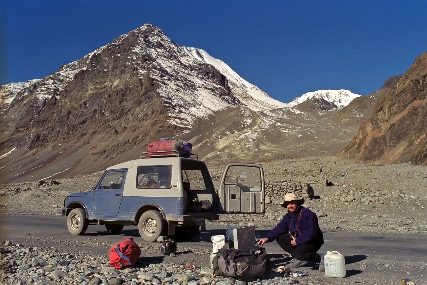 Glenn Guy , the Travel Photography Guru , unpacking the jeep prior to another automotive repair on the road to Pangong Tso, Ladakh , India back in the early 90's.