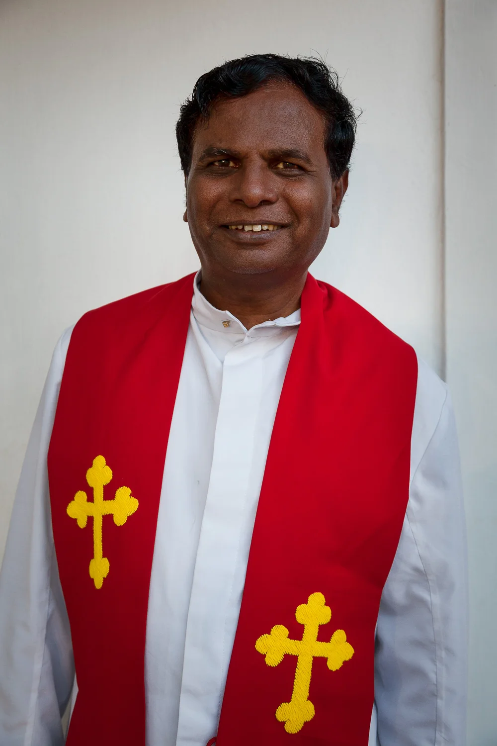 A portrait of the head priest at St. Thomas Mount National Shrine in Chennai, India .