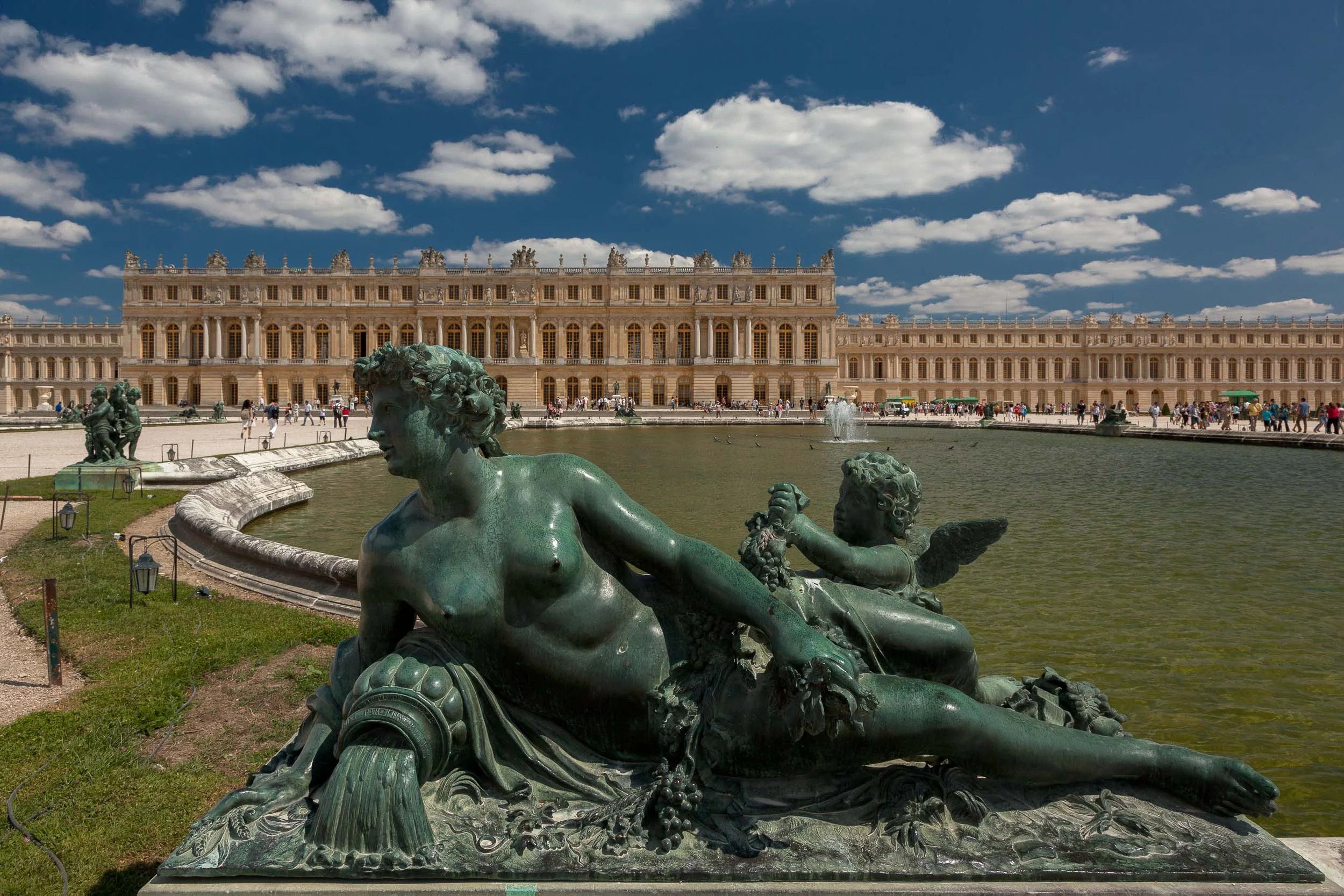 Statue, depicted in a state of repose, in the grounds of Versailles.