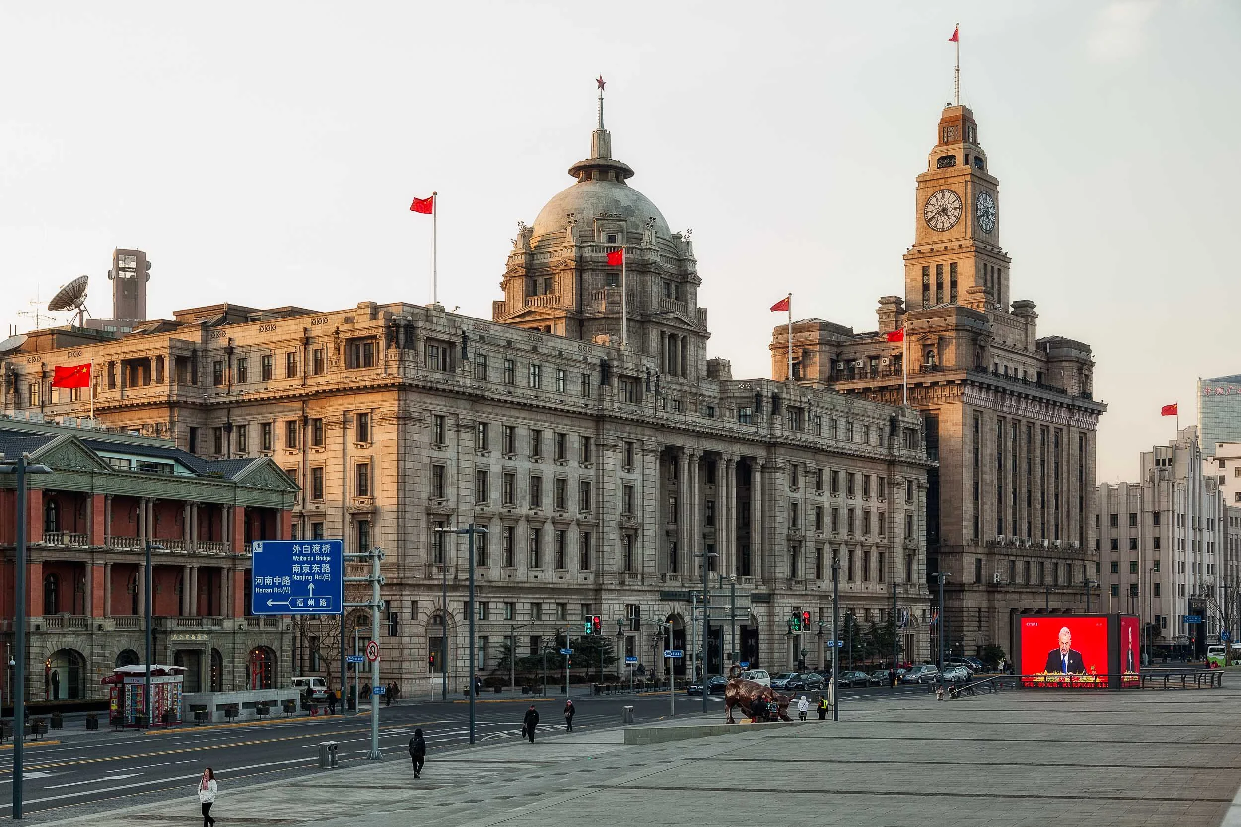 A view of The Bund near the corner of Nanjing Road in Shanghai, China .