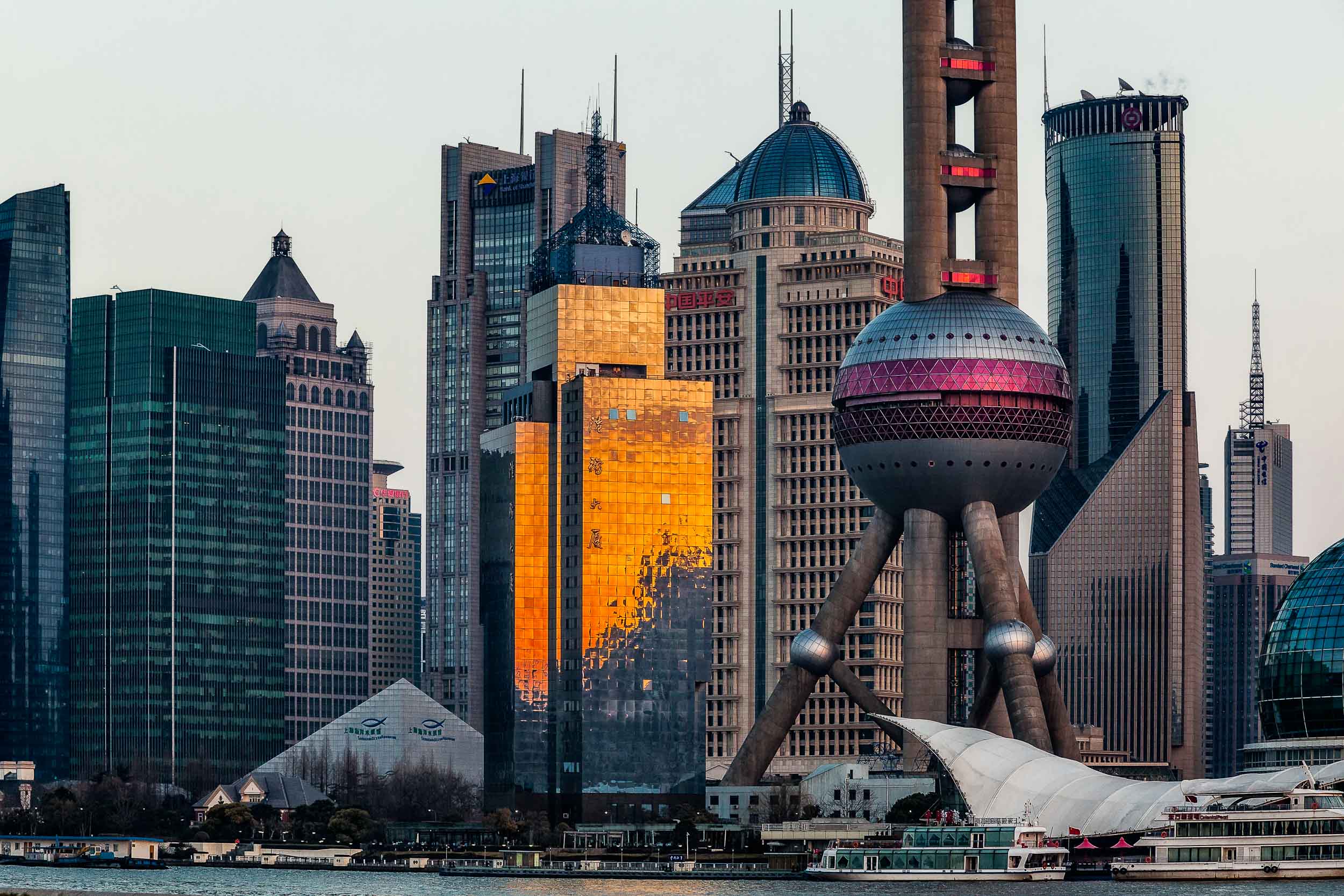 Pudong skyline at sunset from The Bund in Shanghai, China.