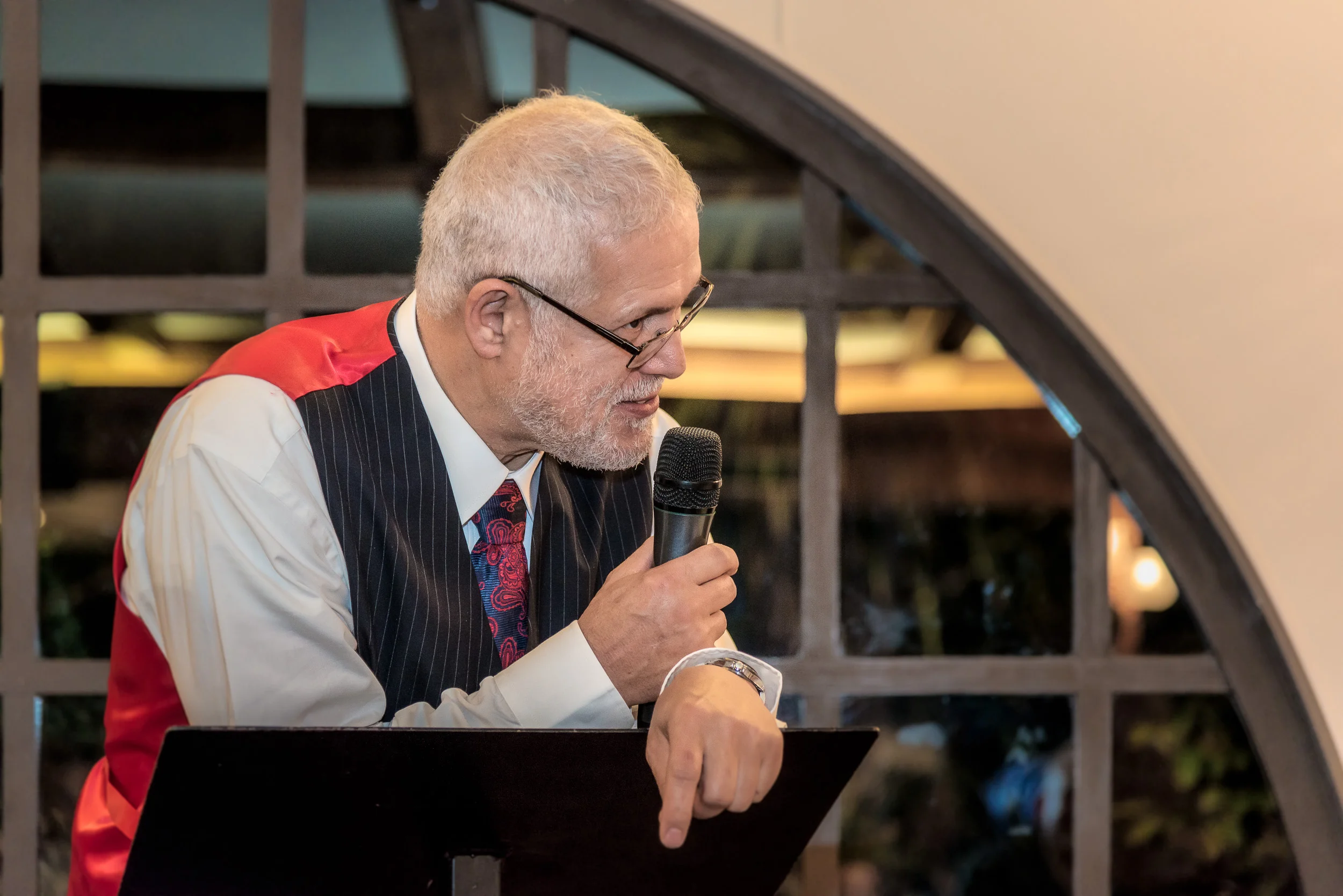 The bride's dad making a speech, with an appropriate mix of humour and advice, at the wedding reception .