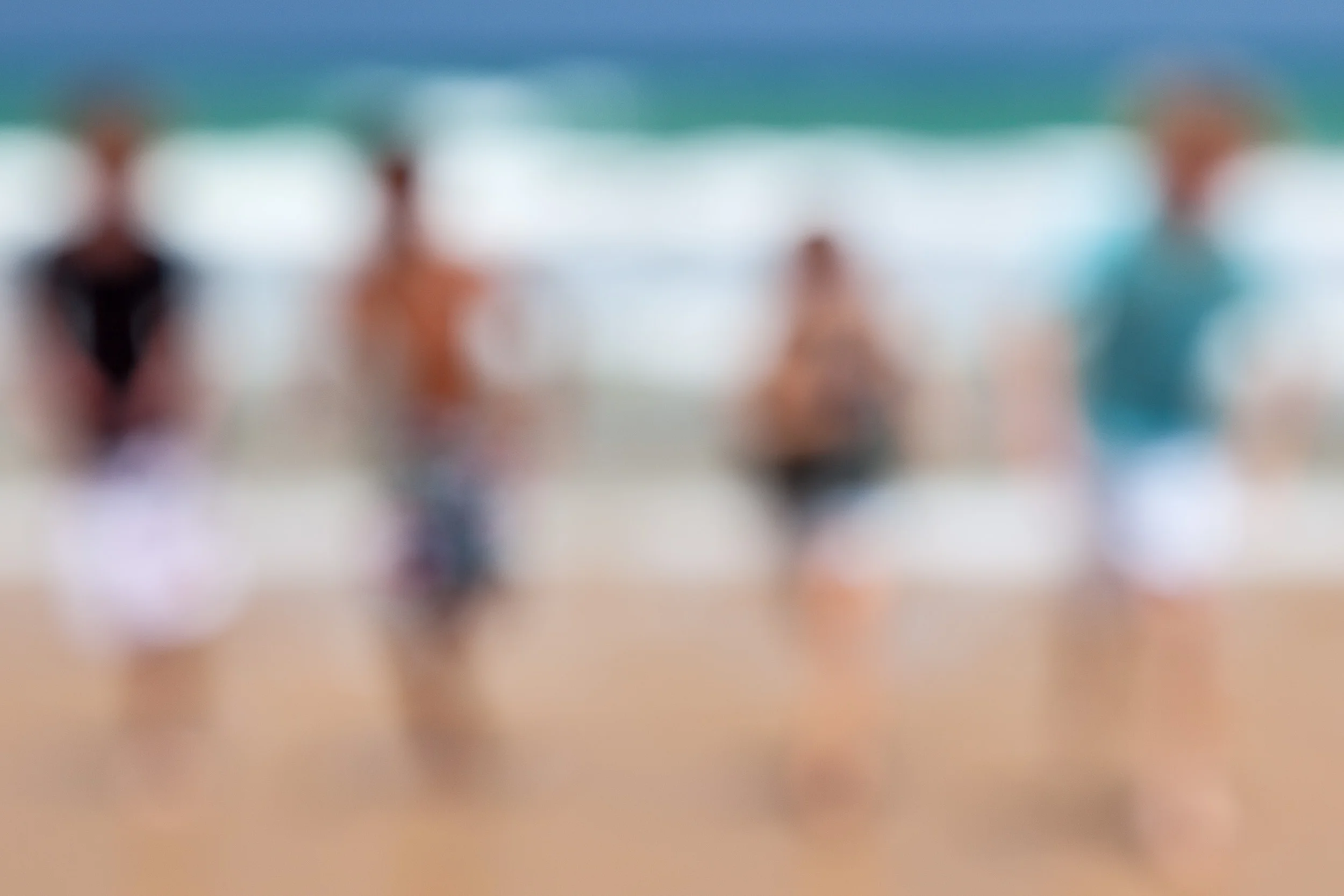 Four young friends having a fantastic time on the beach at Seaspray, Australia . As the years pass memories of that day will fade. But my photos will bring those memories back into focus.