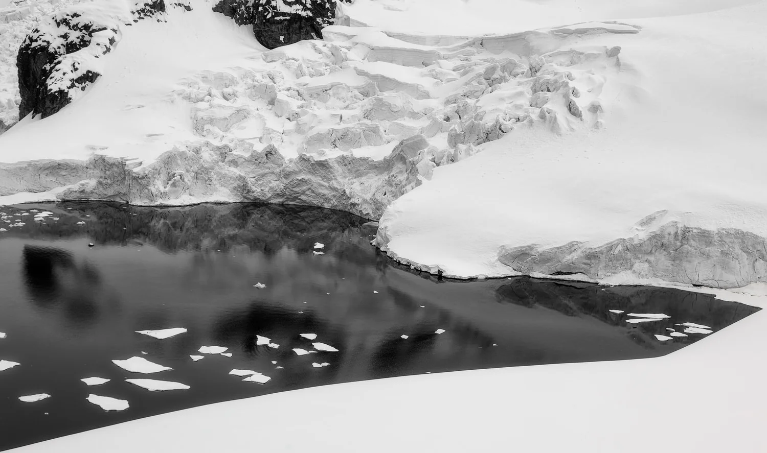 A small lake near the Argentine run Almirante Brown Antarctic Base at Paradise Bay in Antarctica .