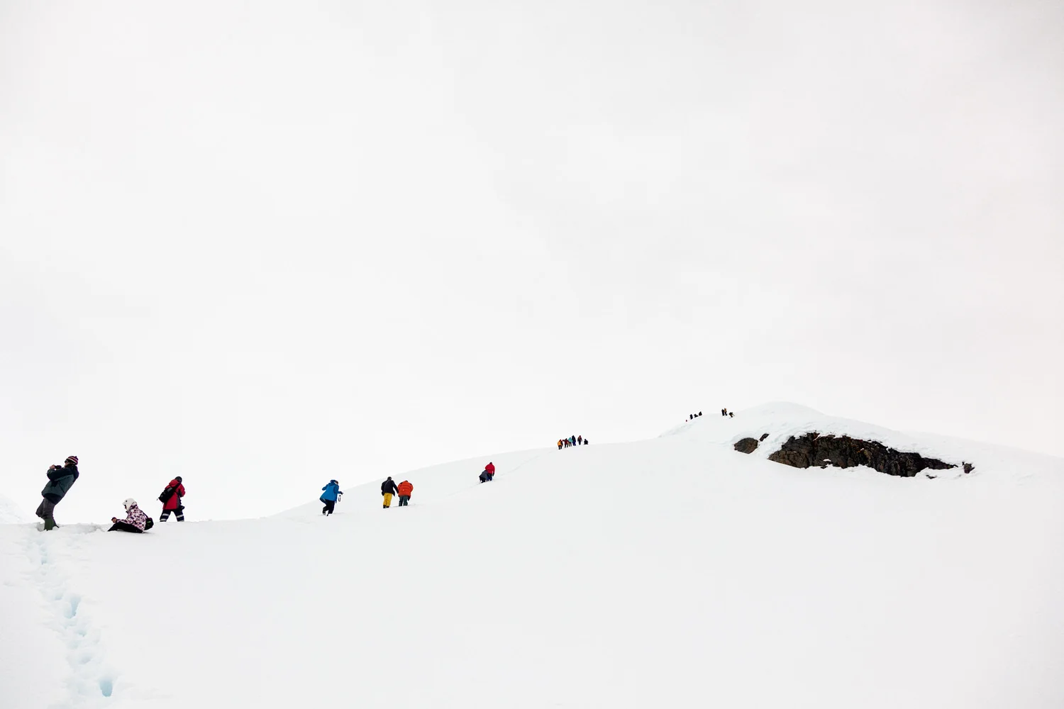 Members of the tour group I co-ran to Antarctica making the steep climb, thorugh heavy snow, up the hill at Brown Station .