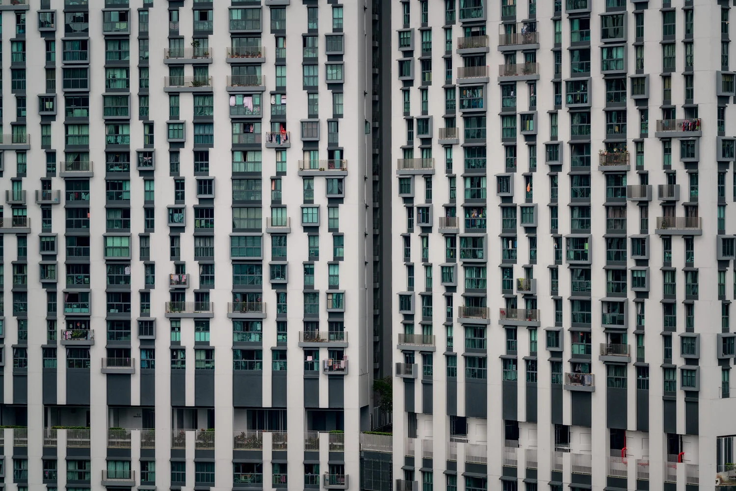 Design prinicples of symmetry and repetition explored in this photo of a high-rise apartment block in Singapore .