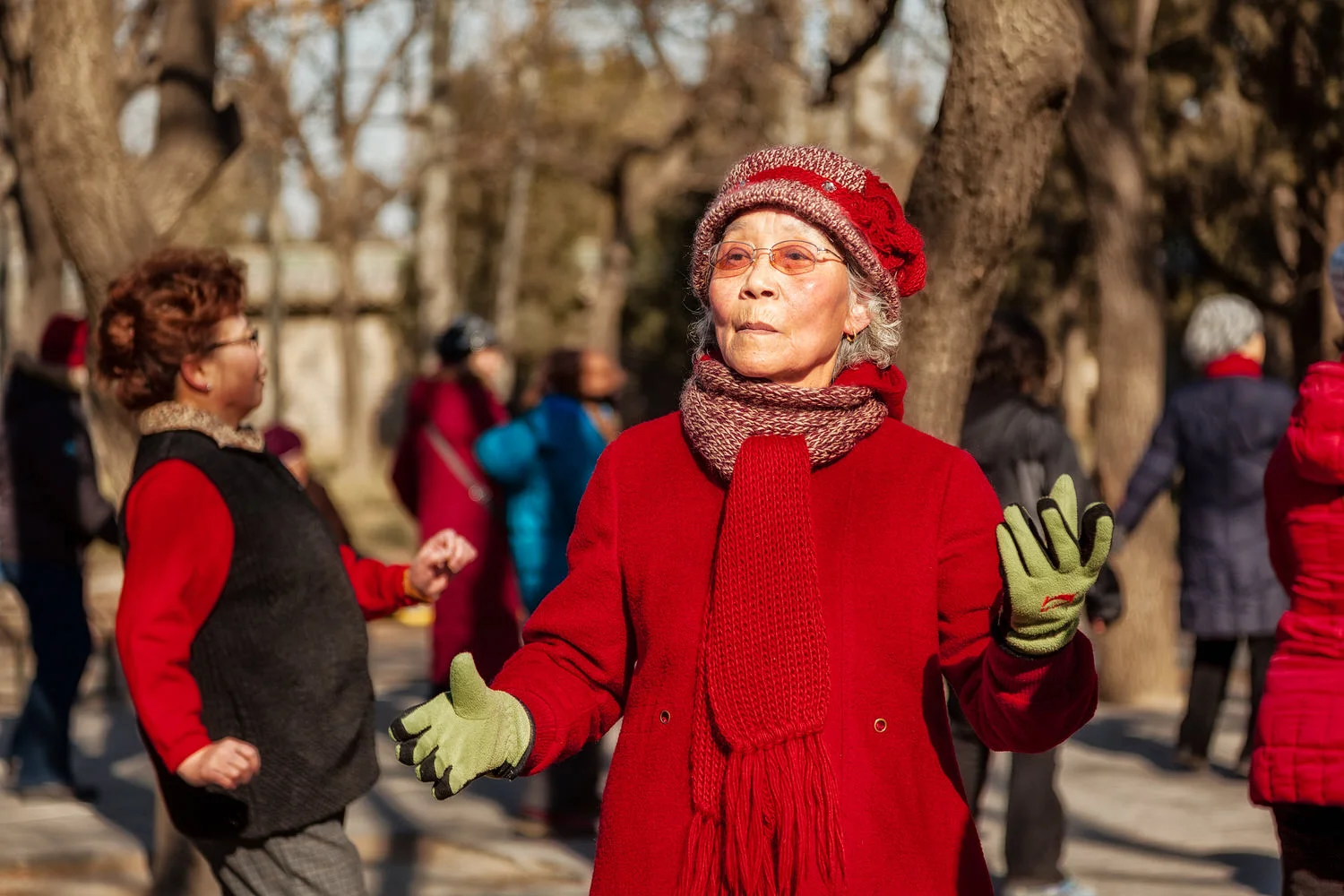Selective focus separating women dancing at the Temple of Heaven, Beijing, China.