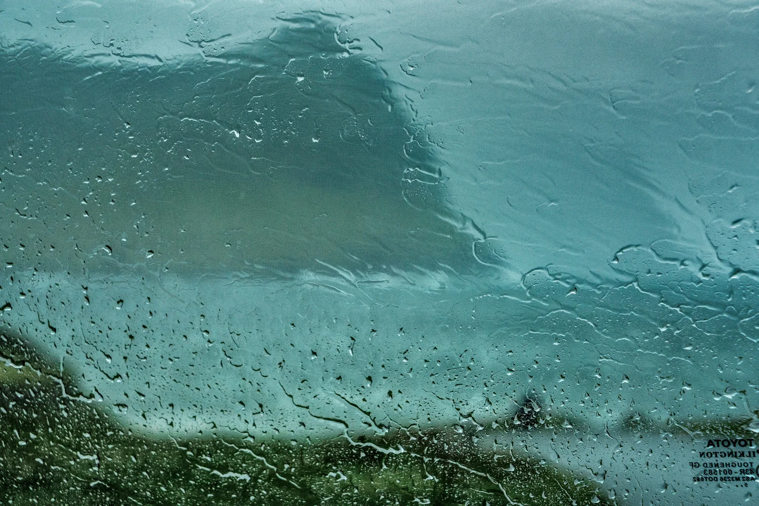 This photo was made, while sheltering in my car from heavy rain and gale force winds , in the town of Vidareidi , the northernmost settlement in the Faroe Islands .