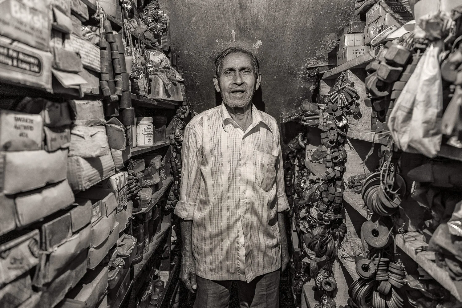 A man in his spare parts store in the backstreets of Kolkata , India.
