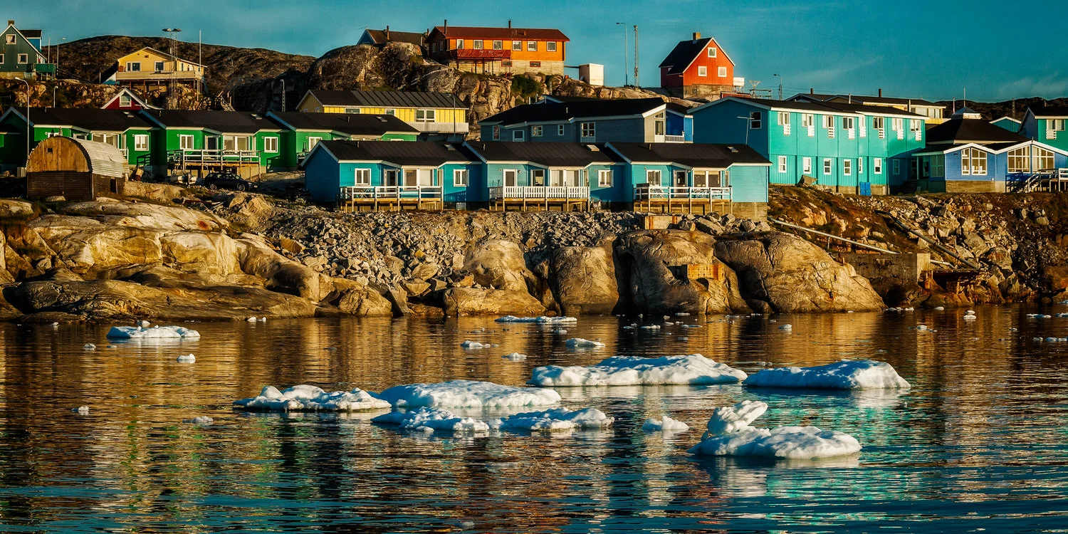 Colorful accommodation overlooking the waters of the Ilulissat Icefjord in Ilulissat, Greenland .