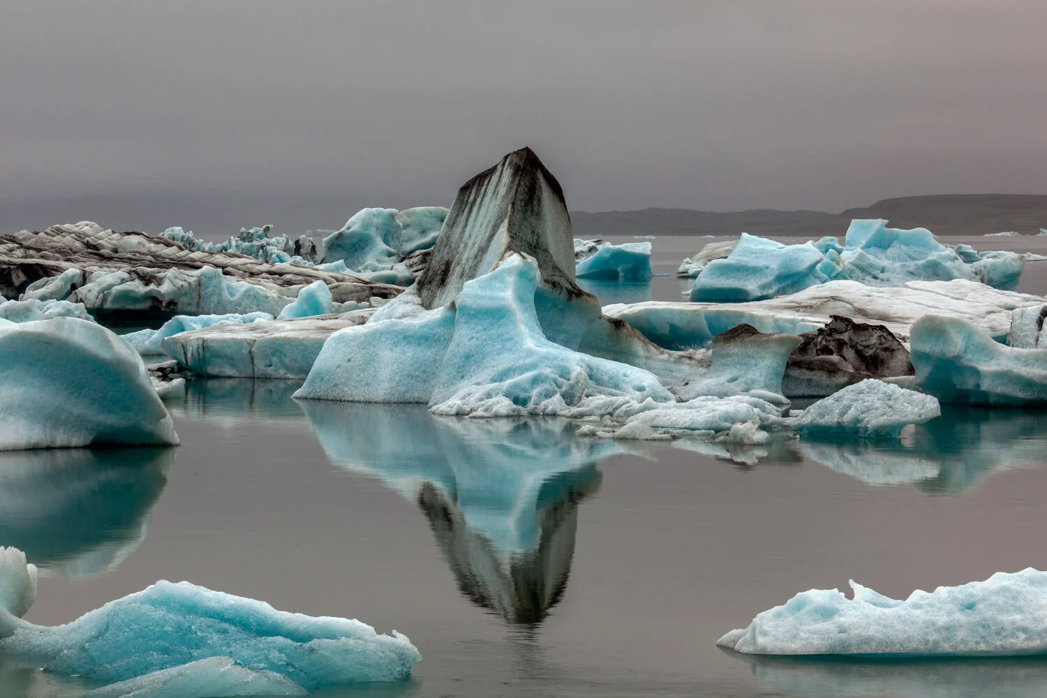 Large icebergs and a beautiful reflection on the Jokulsarlon Glacier Lagoon, Iceland.