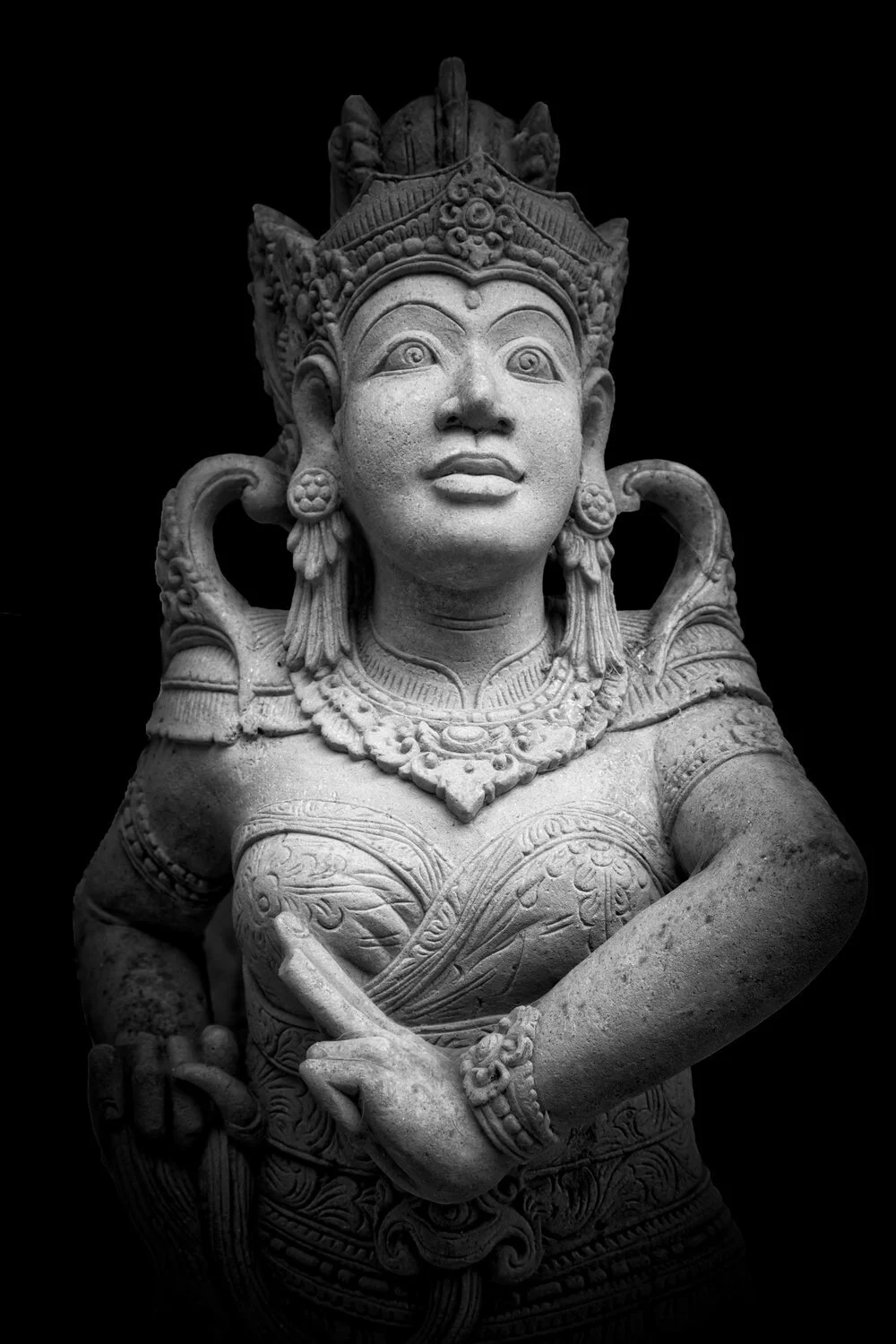 Luminous Hindu statue emerges from the darkness in Bali, Indonesia.