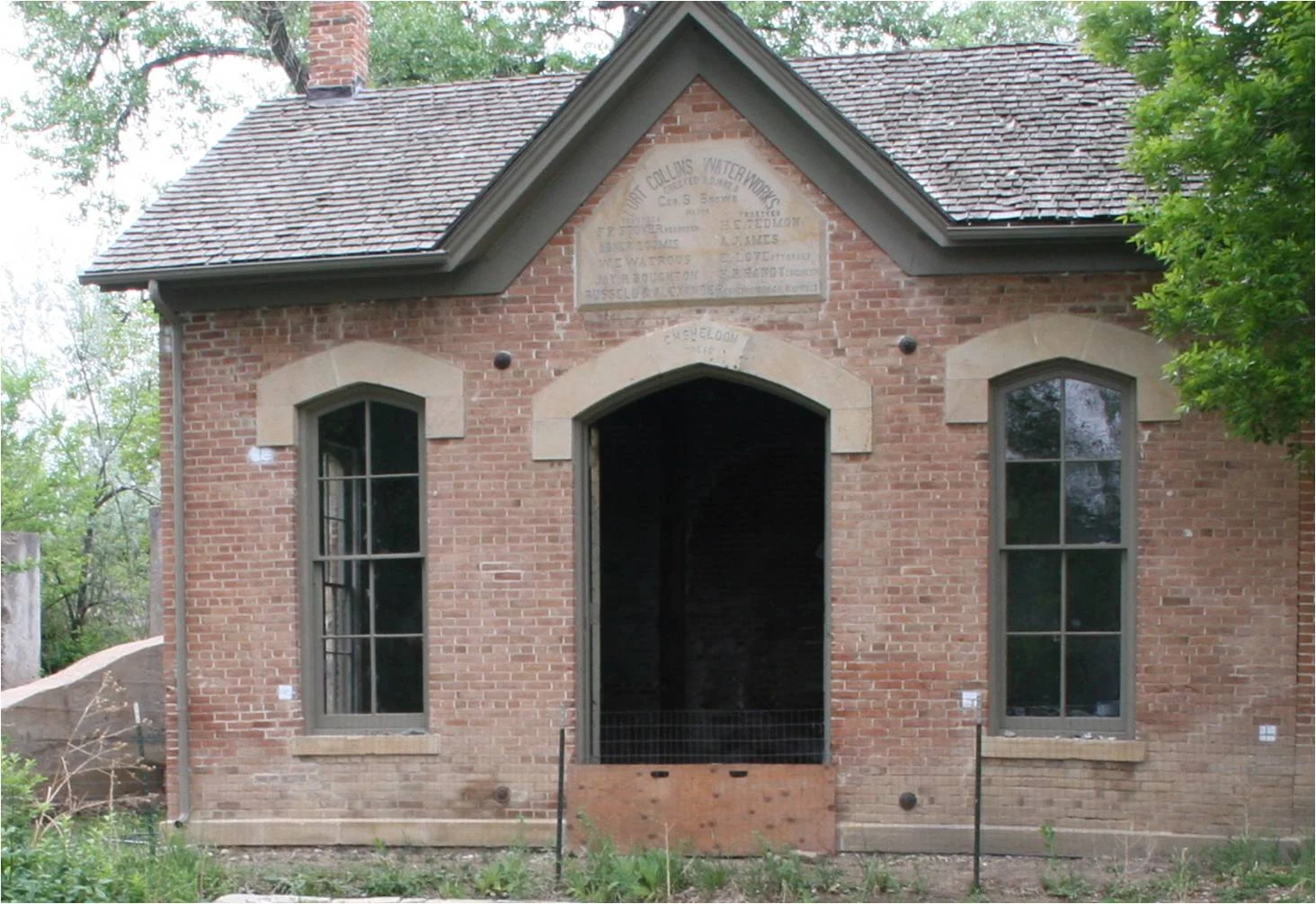 The names of the Fort Collins officials involved in the 1882-1883 Water Works construction are listed on a sandstone plaque mounted on the east wall above the doors.