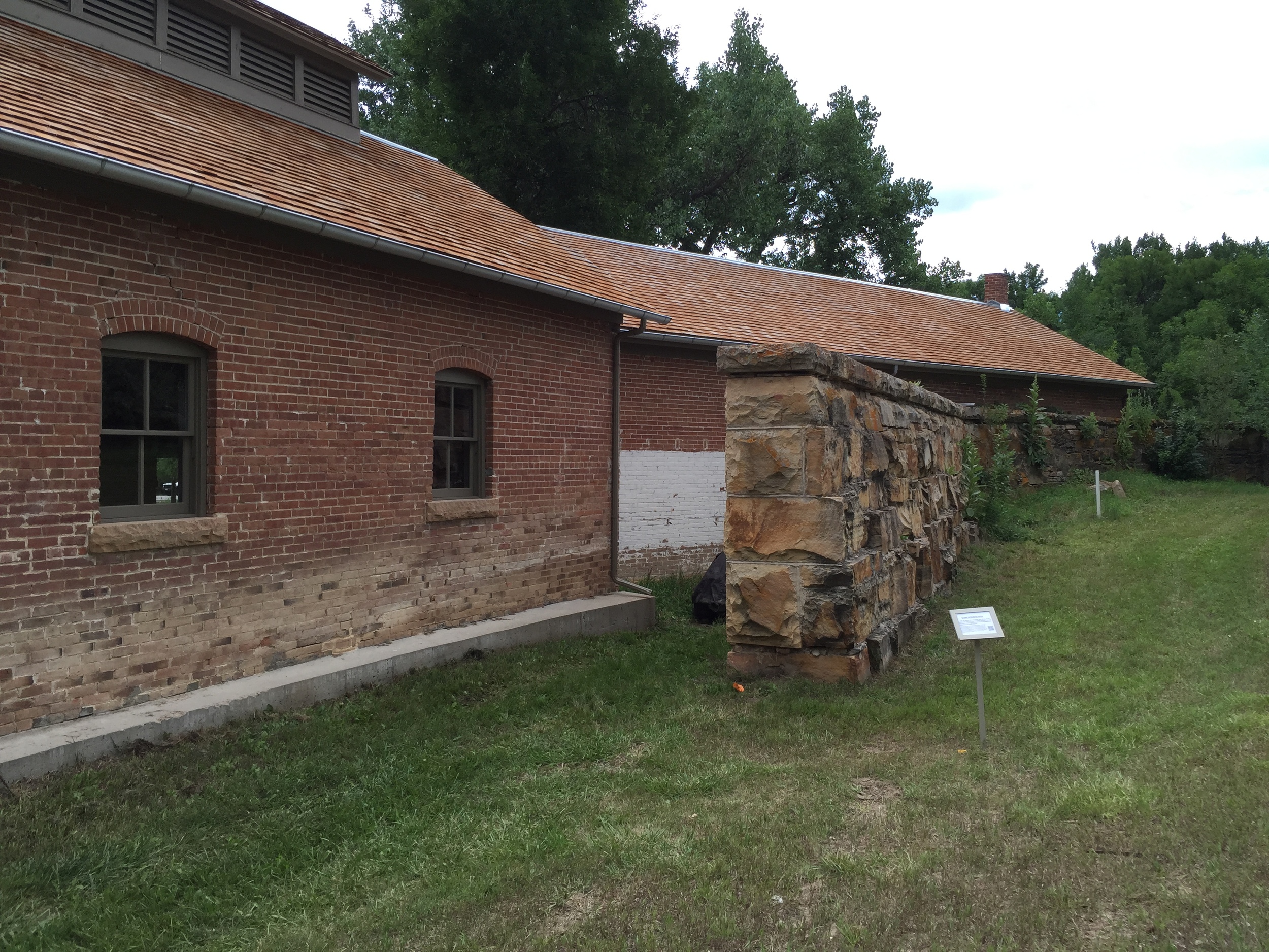  Rear of the building, showing the massive stone retaining wall of the former reservoir. 