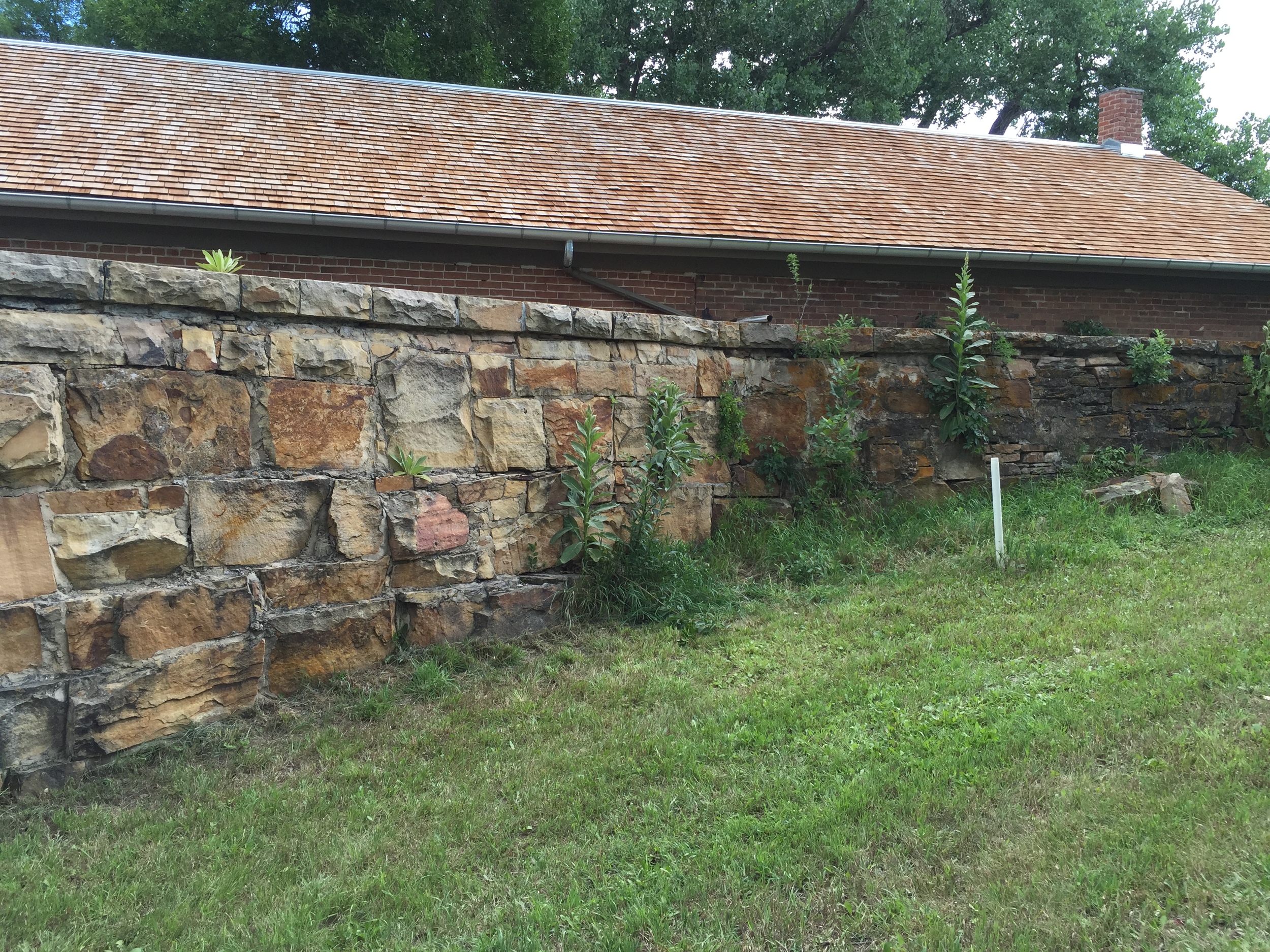  Stone retaining wall for the former reservoir behind the Water Works building. 